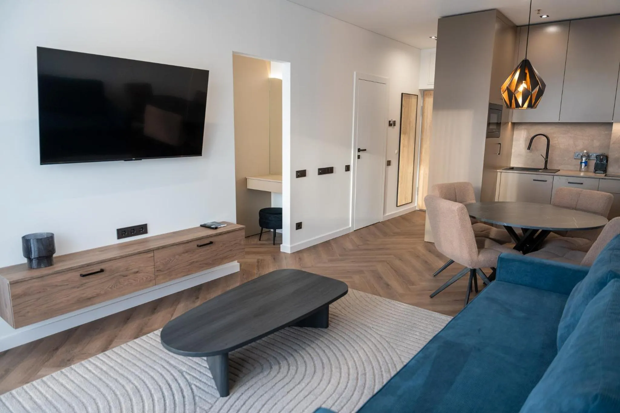 Communal lounge/ TV room in Aparthotel Nemunas