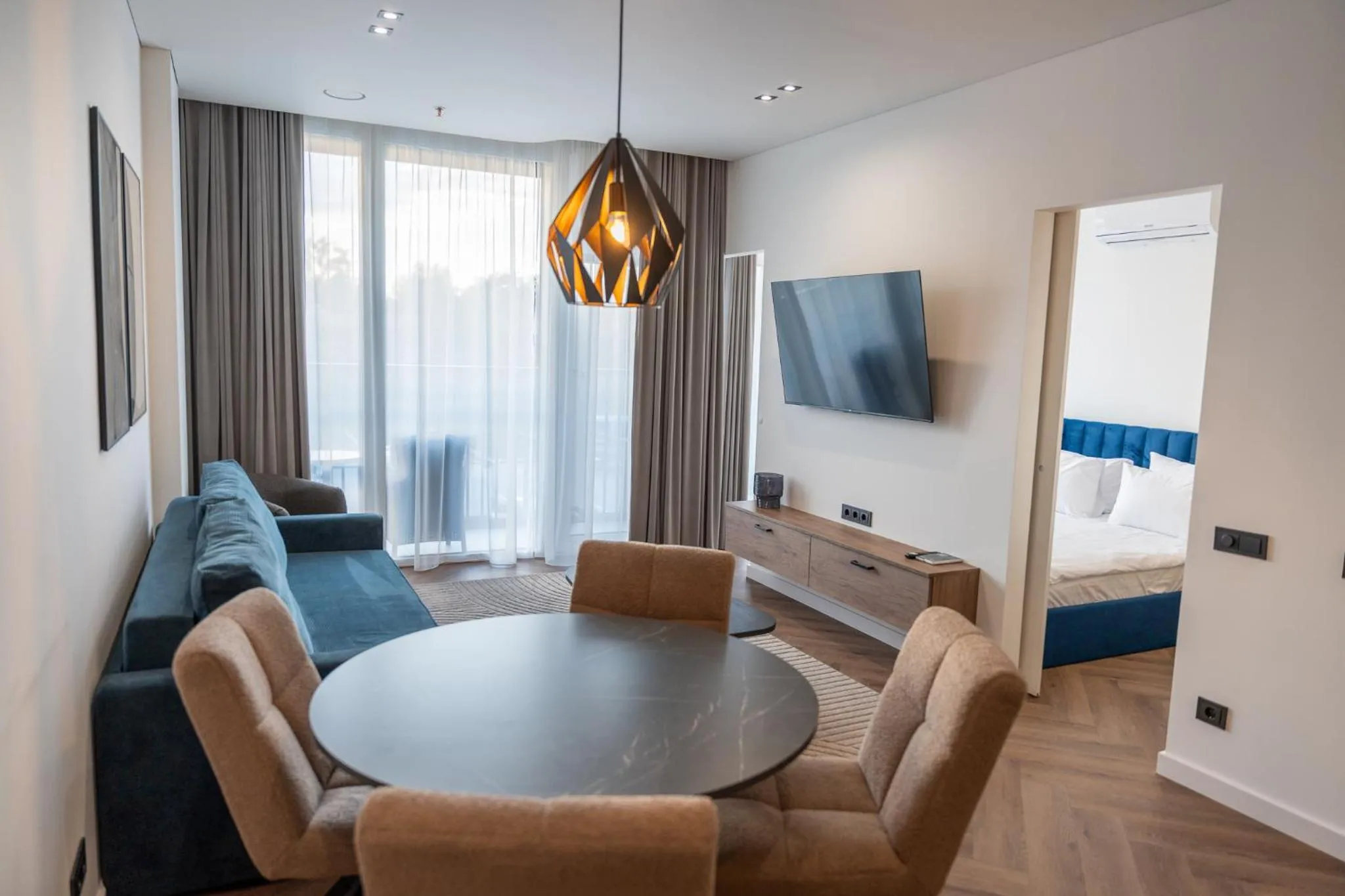 Communal lounge/ TV room in Aparthotel Nemunas