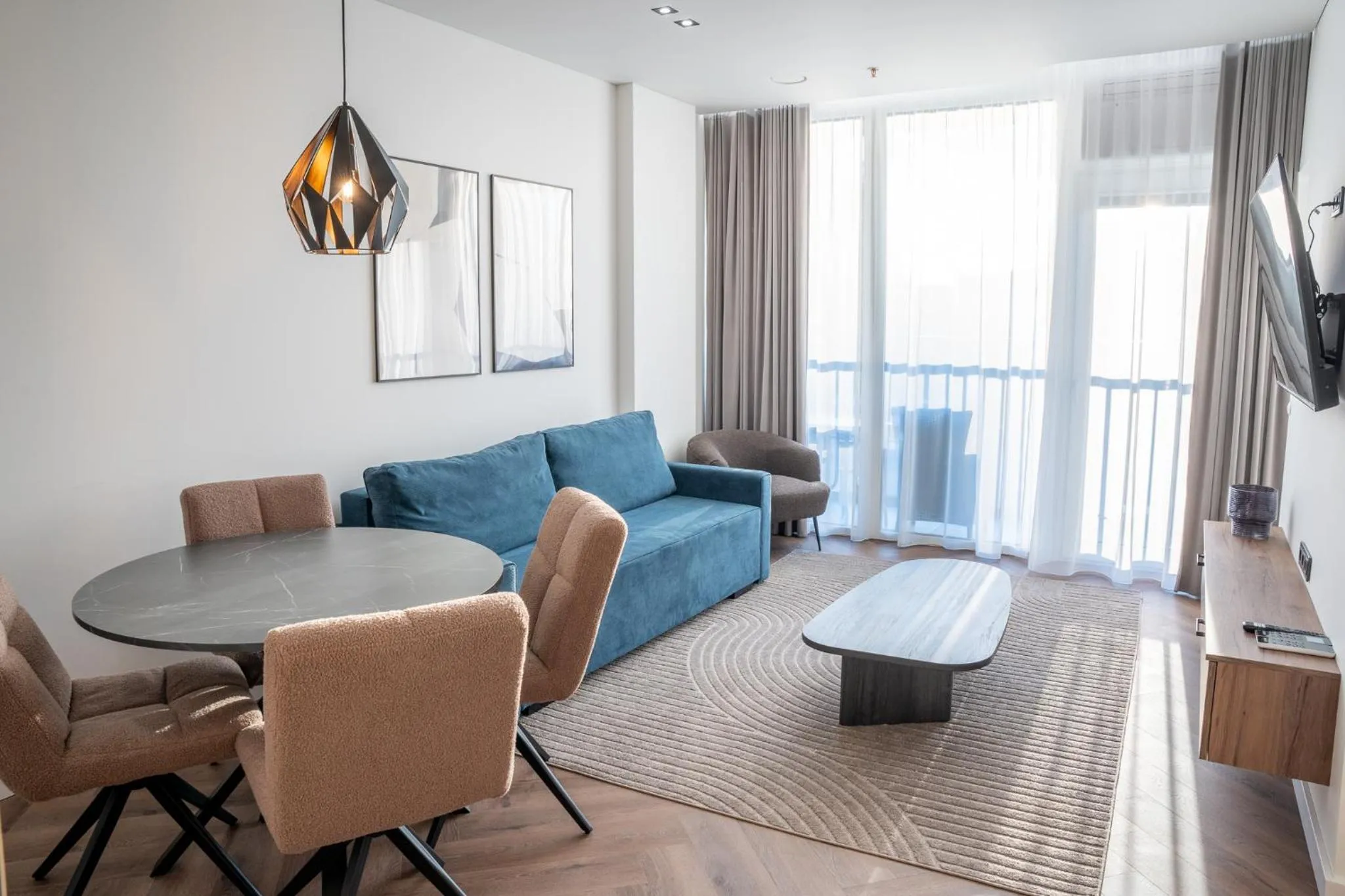 Communal lounge/ TV room in Aparthotel Nemunas