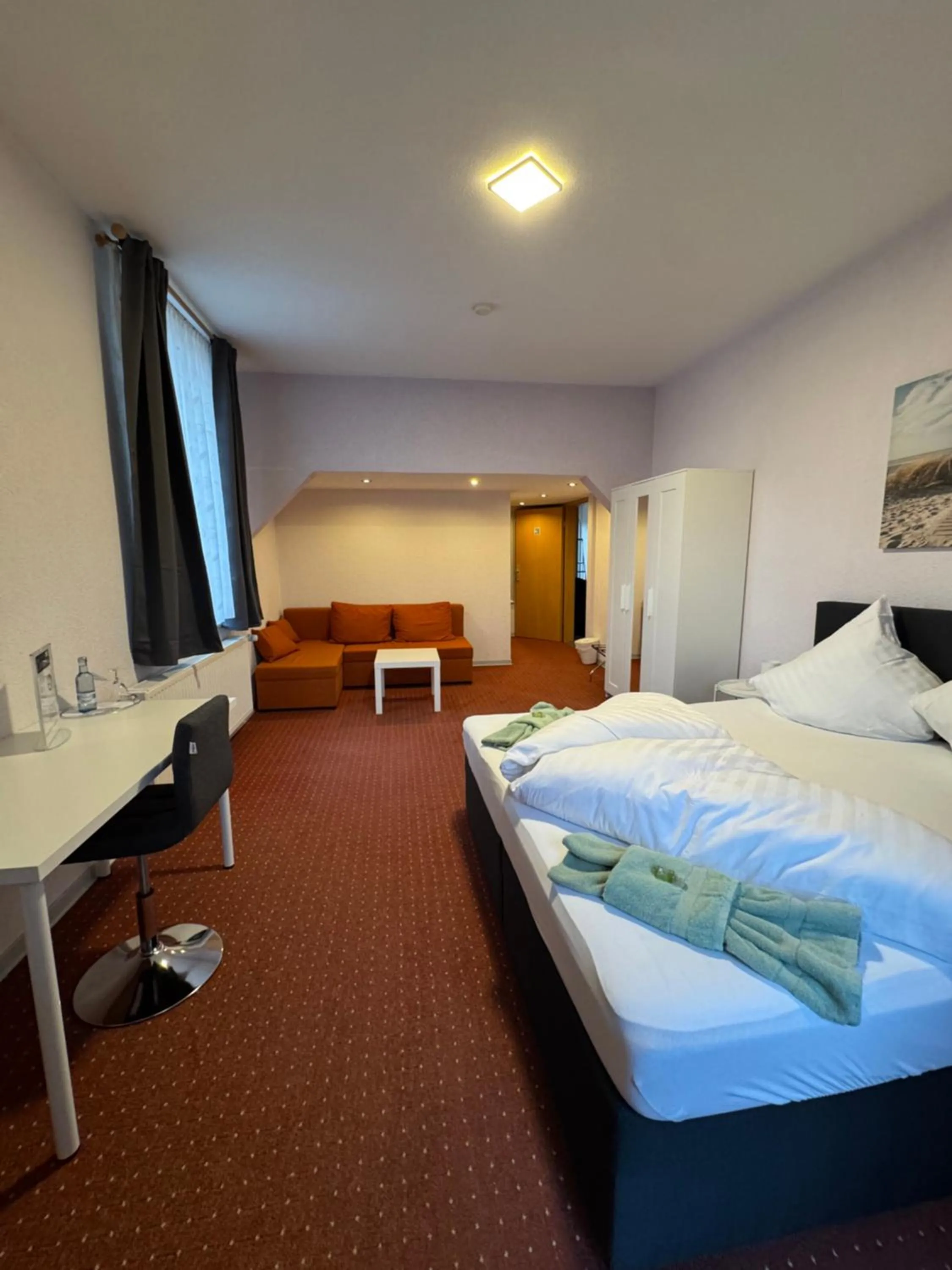 Living room, Bed in Hotel-Restaurant Christine