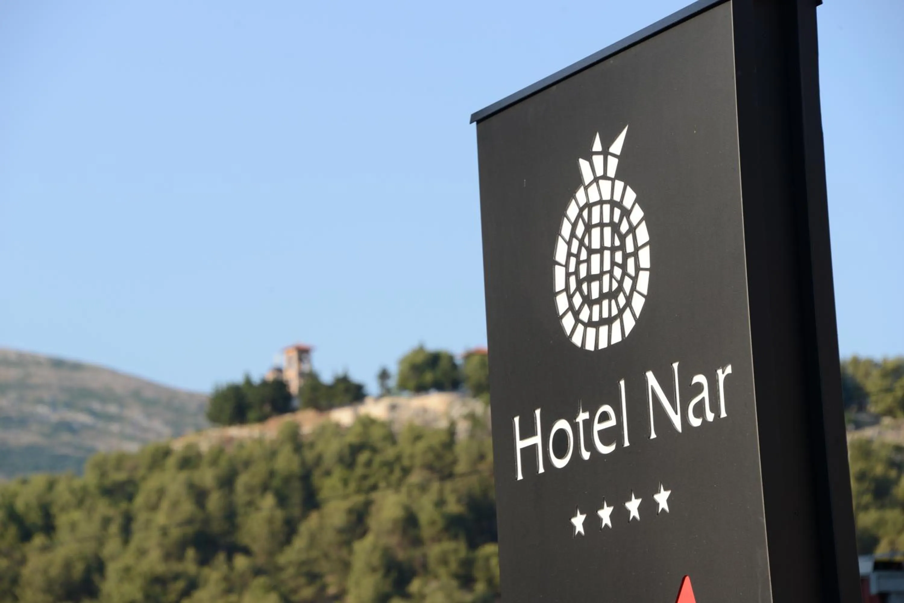 Property logo or sign in Hotel Nar