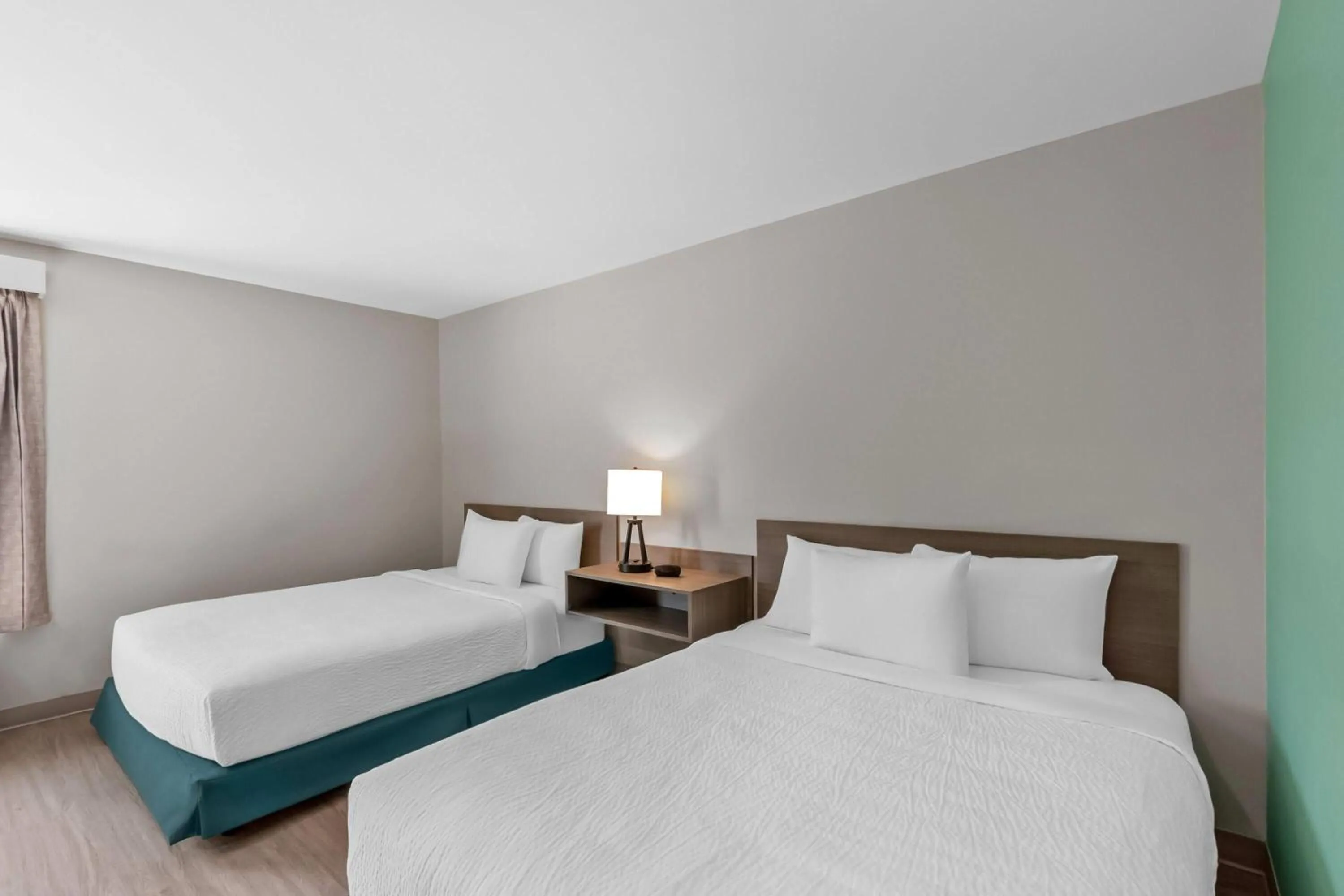 Bed in ECHO Suites Extended Stay by Wyndham Sterling