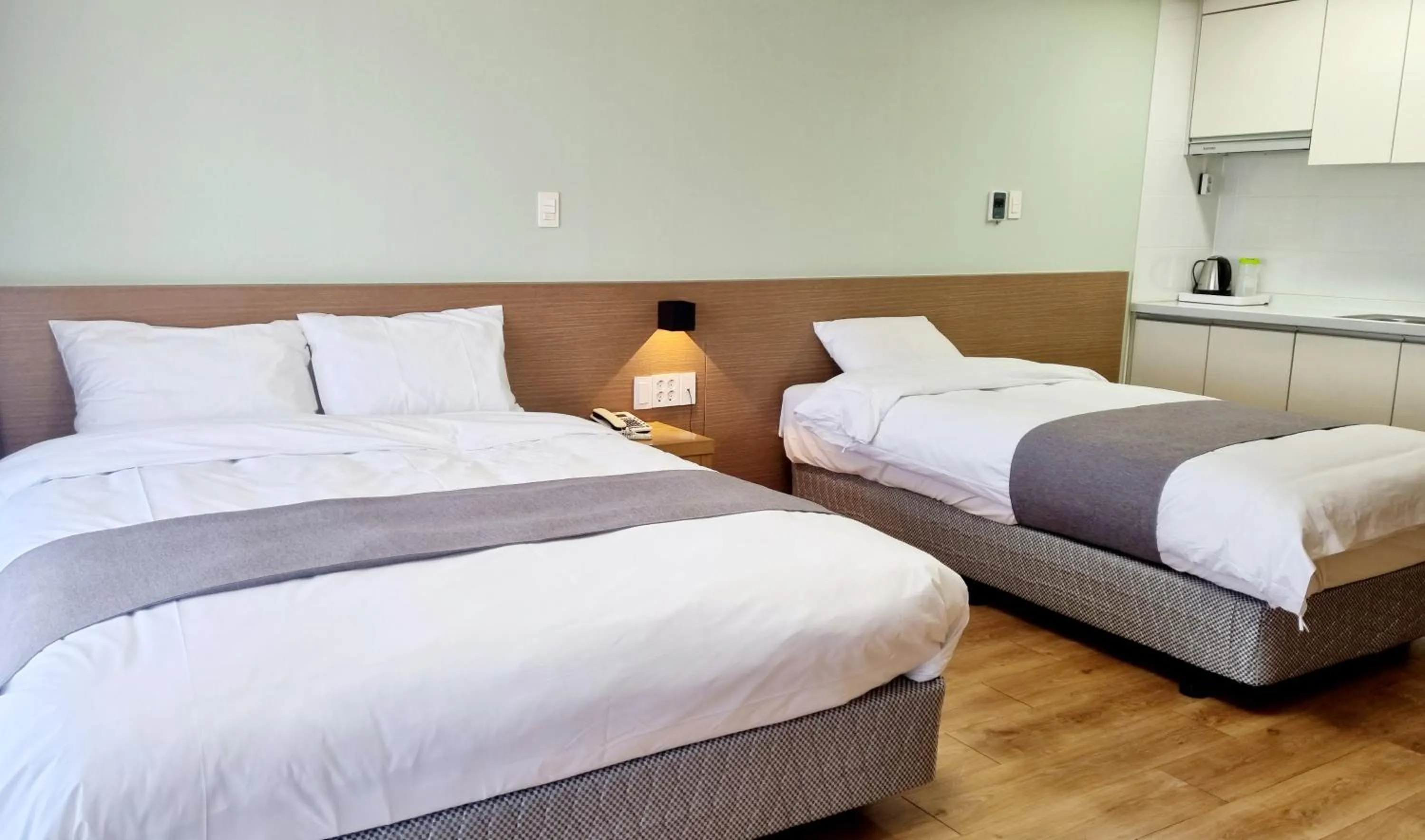 Bed in Hi Jeju Hotel