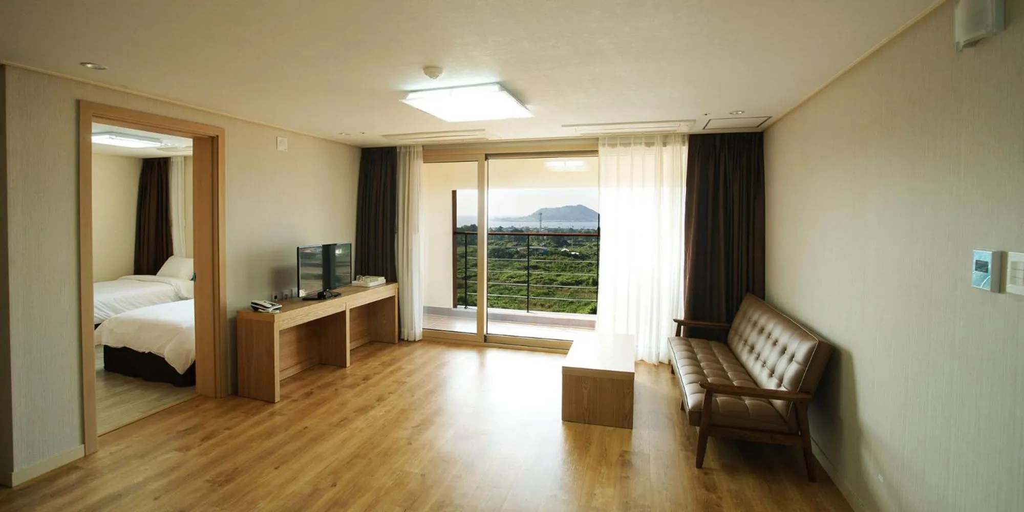 Bed in Hi Jeju Hotel