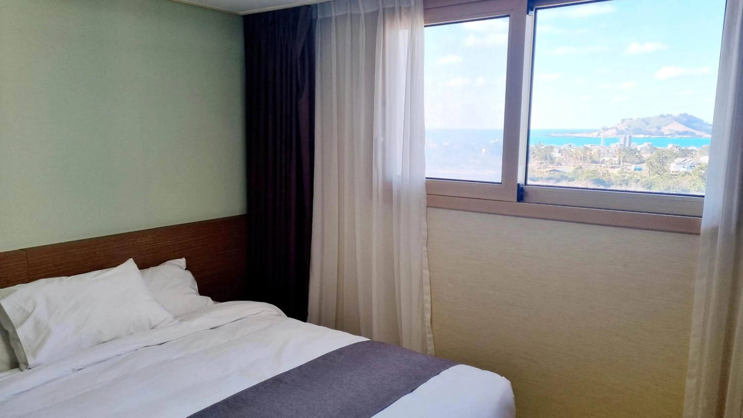 Bed in Hi Jeju Hotel