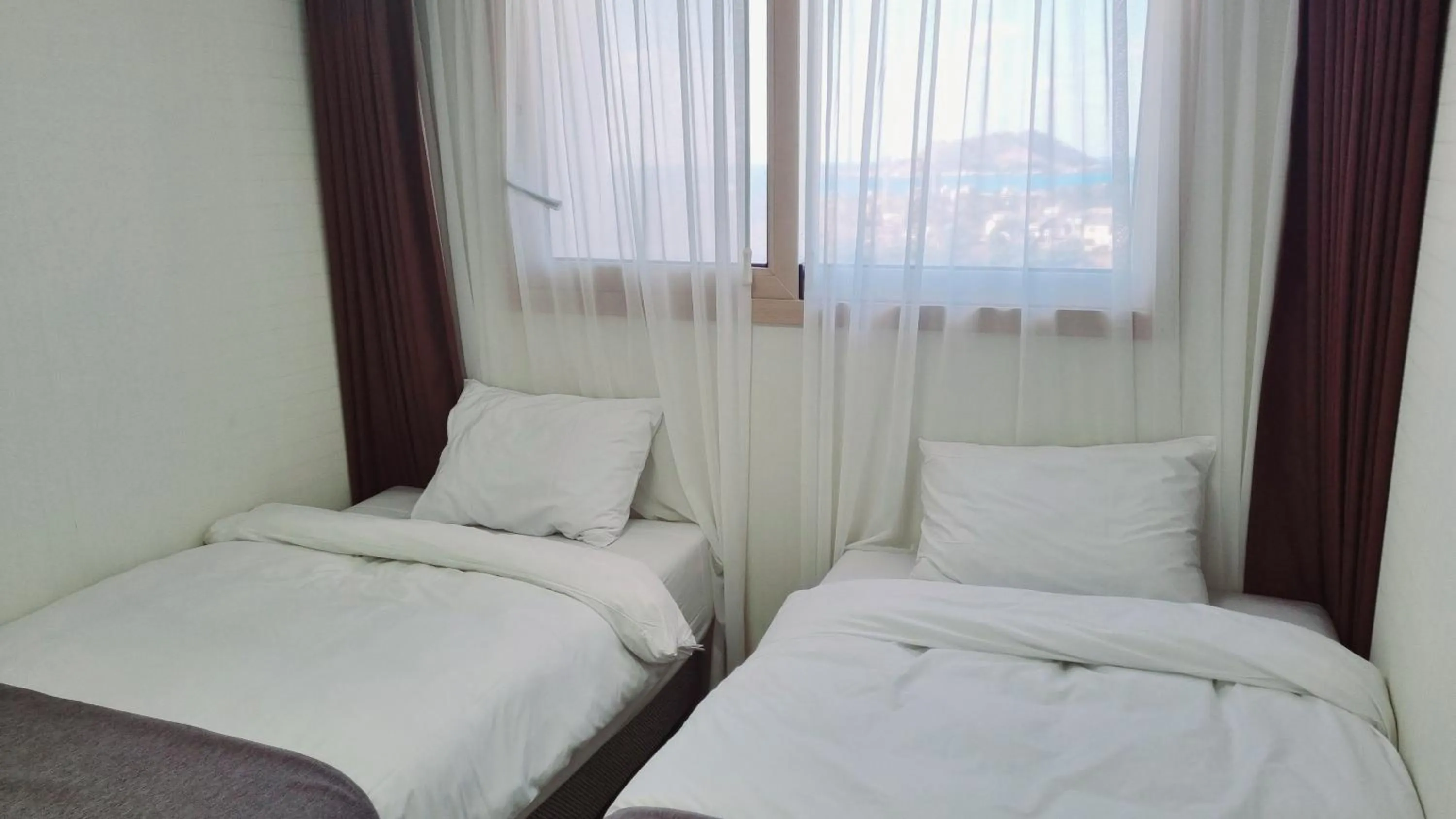 Bed in Hi Jeju Hotel
