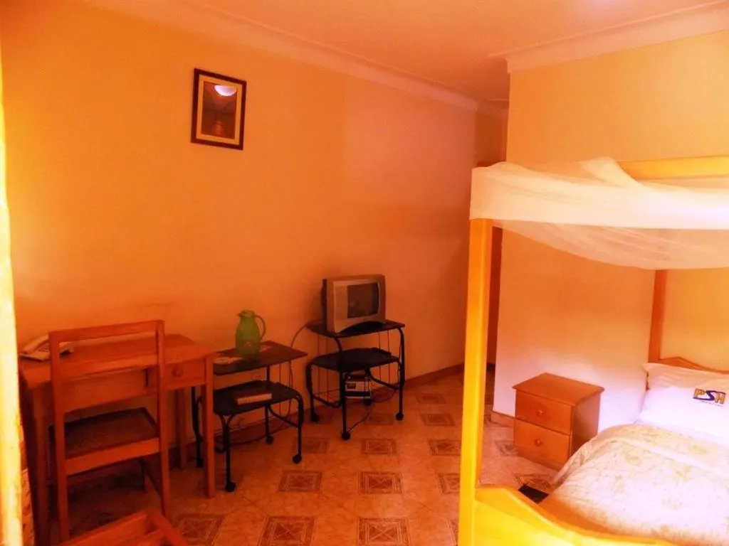 Bed in Palm Springs Hotel Masaka