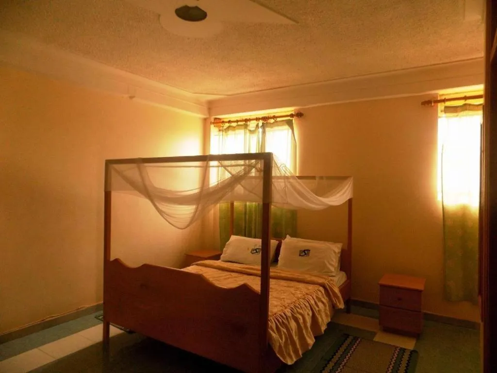 Bed in Palm Springs Hotel Masaka