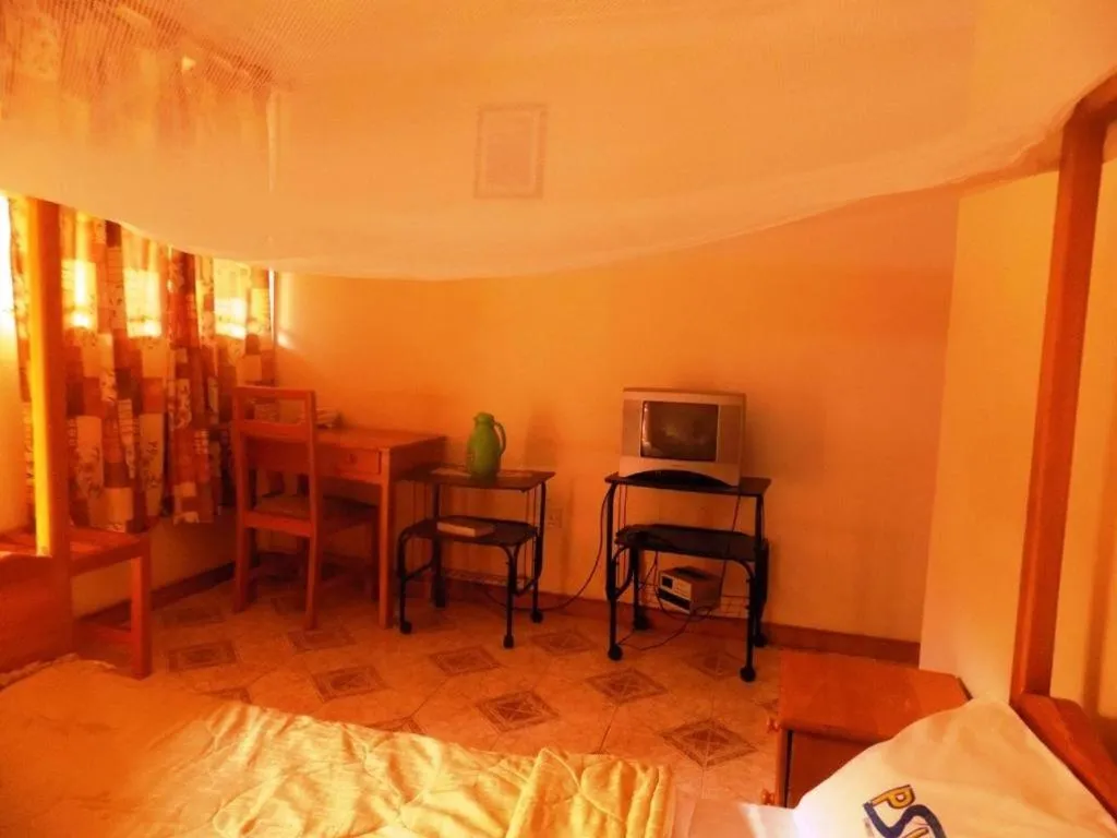 Bed in Palm Springs Hotel Masaka