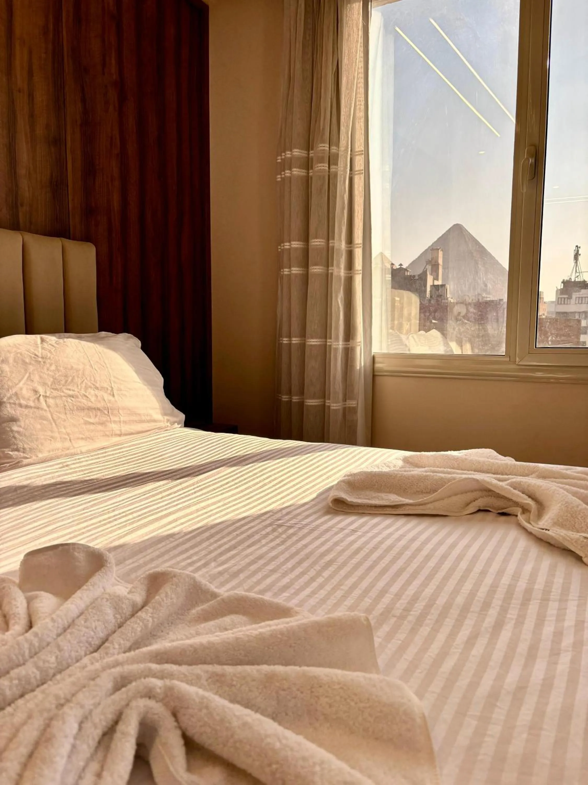 Bed in The Palace Pyramids View Hotel