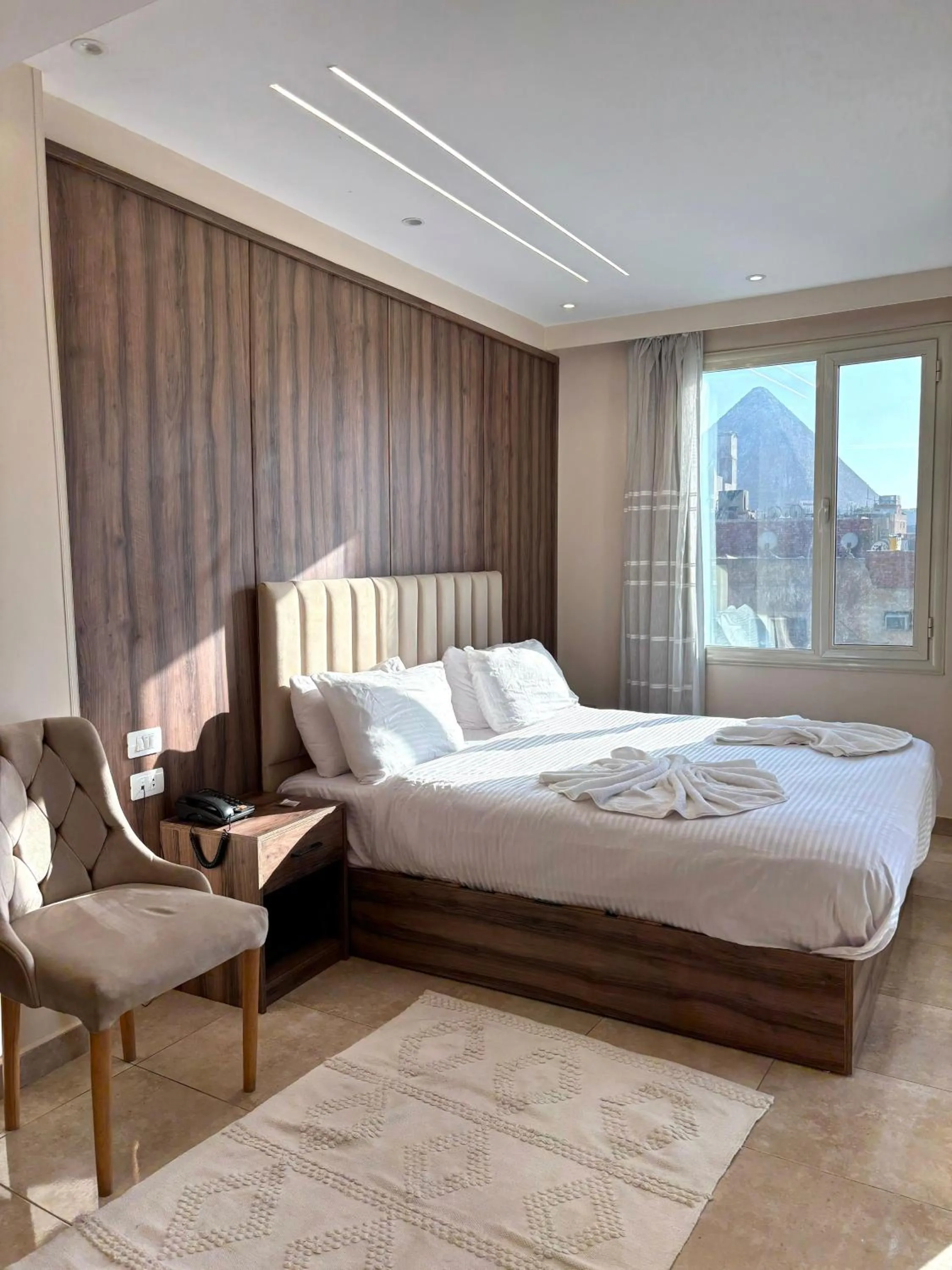 Bed in The Palace Pyramids View Hotel