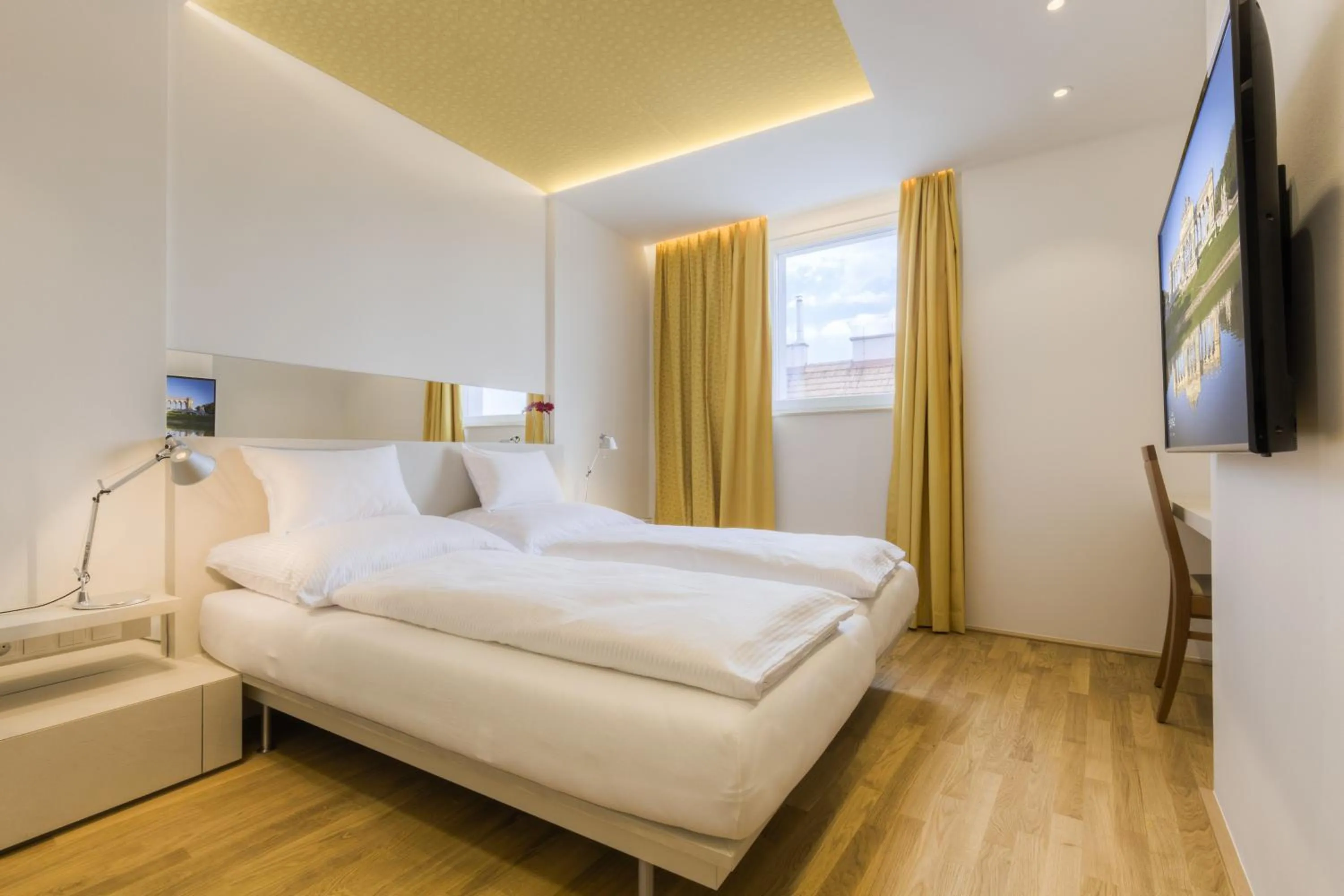 Bed in Vienna Grand Apartments DANUBE