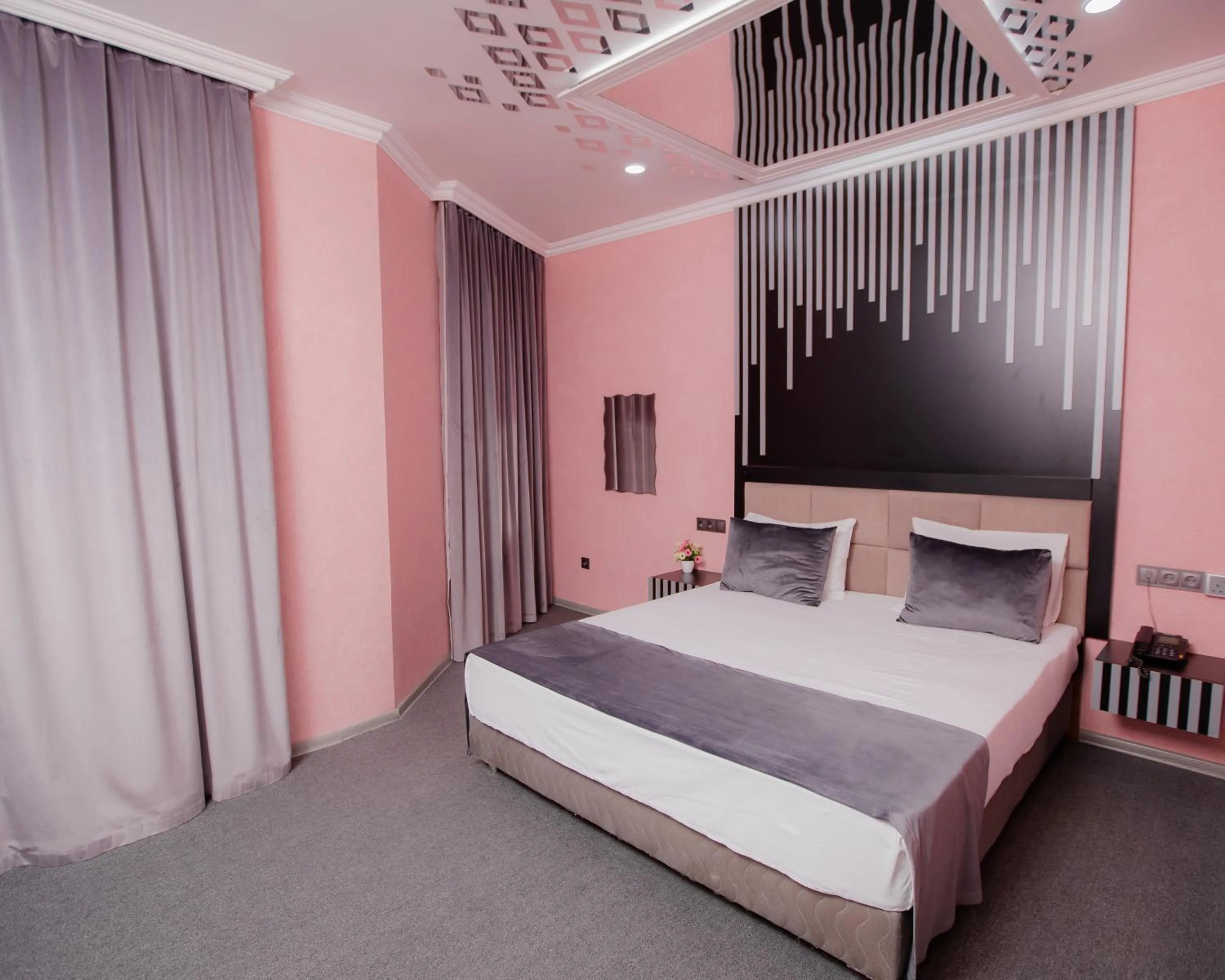 Bed in Corniche White City Hotel