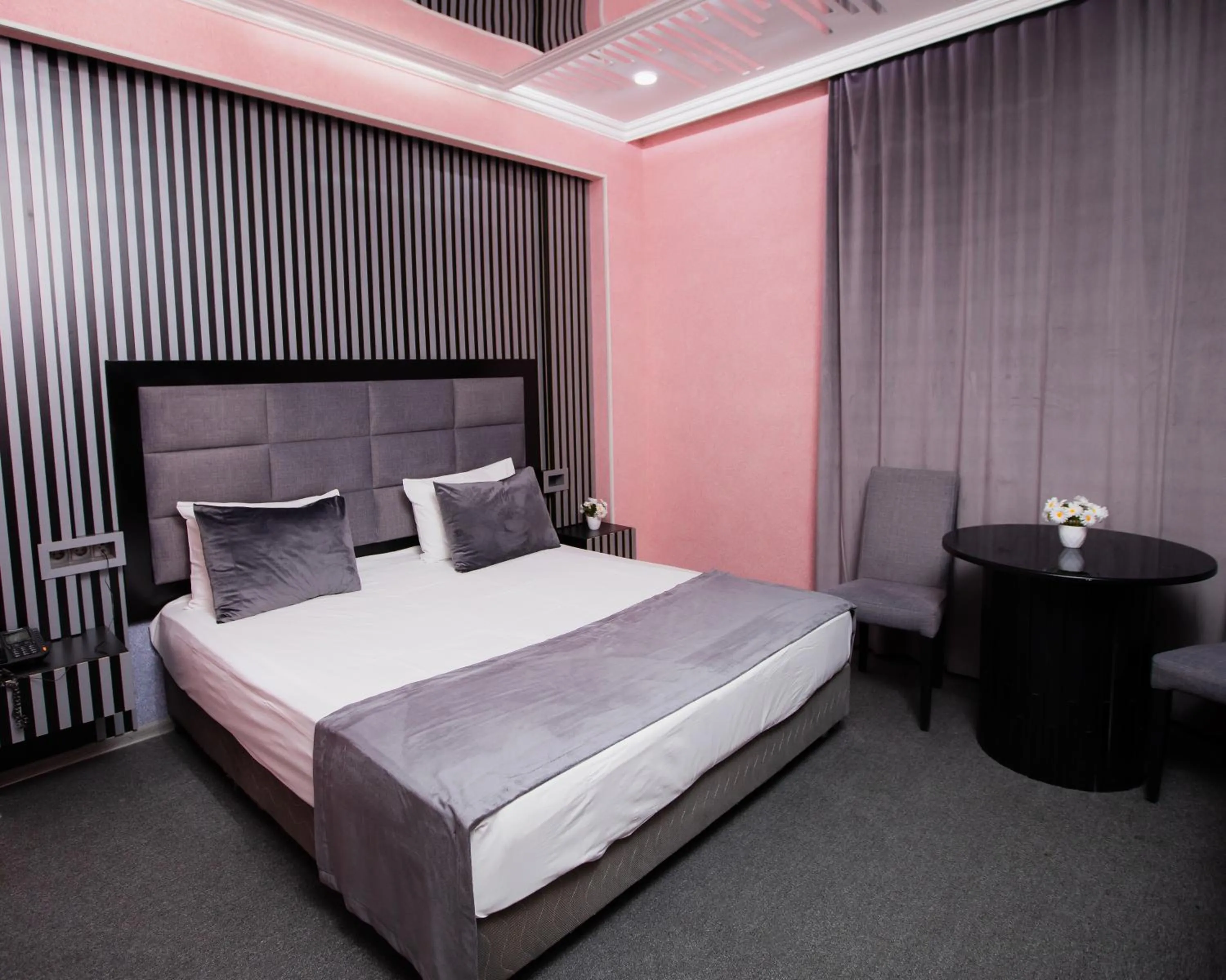 Bed in Corniche White City Hotel