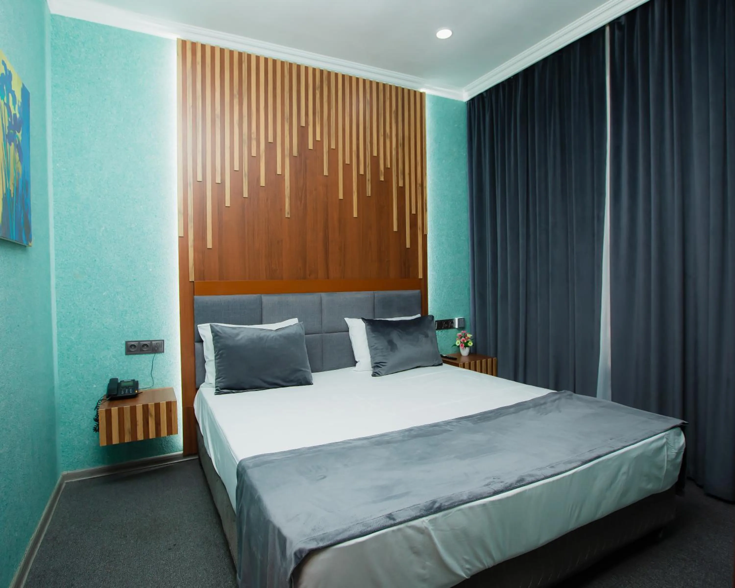 Bed in Corniche White City Hotel