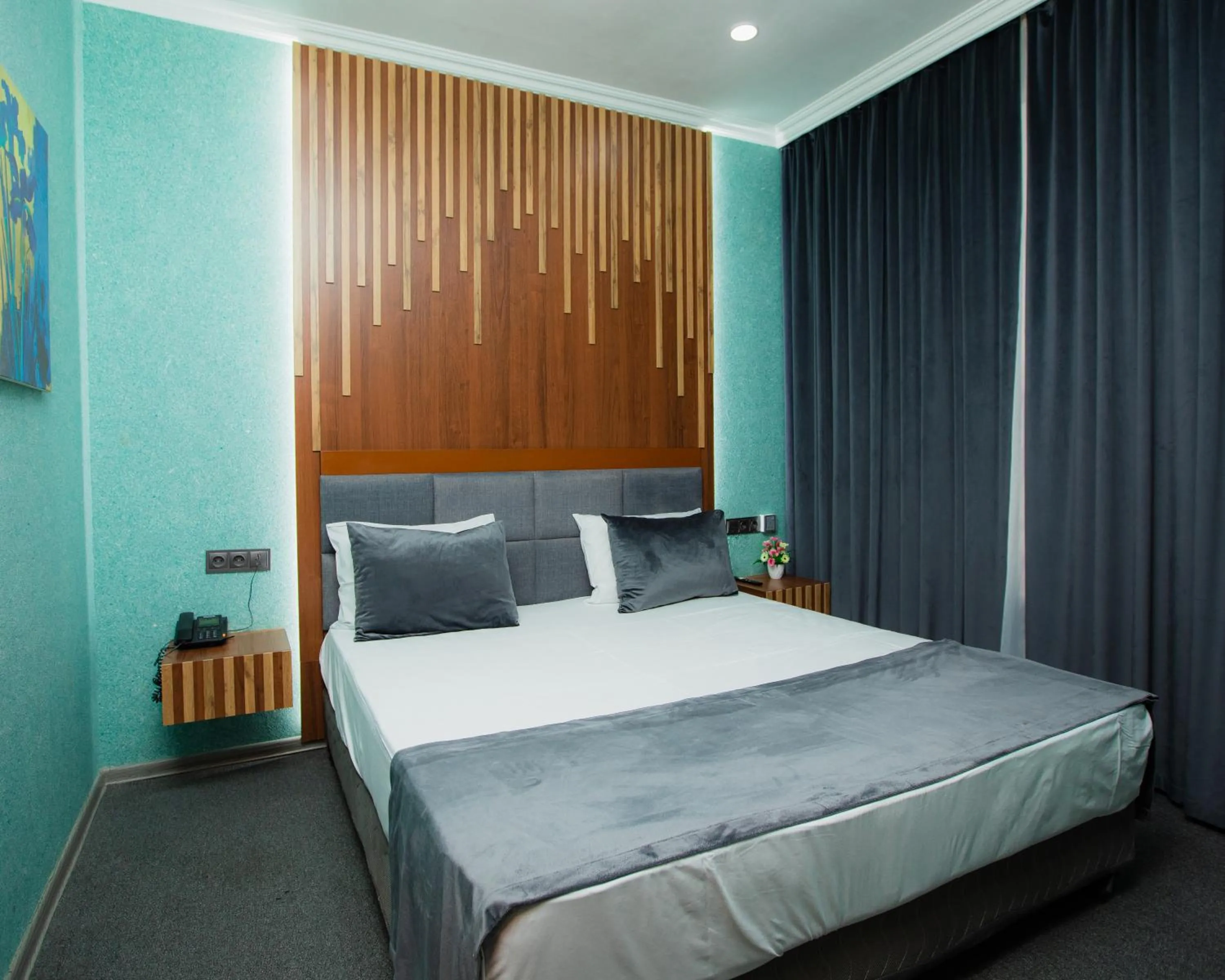 Bed in Corniche White City Hotel