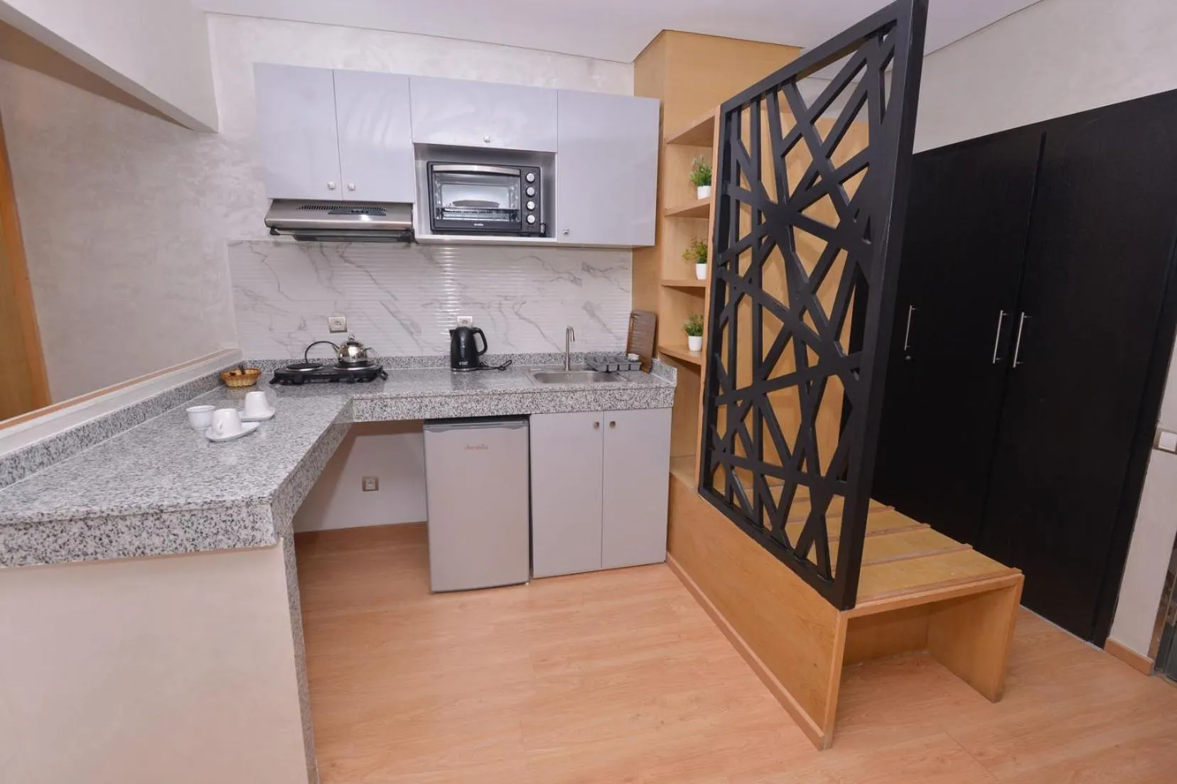 Kitchen or kitchenette in Le 135 appart hotel