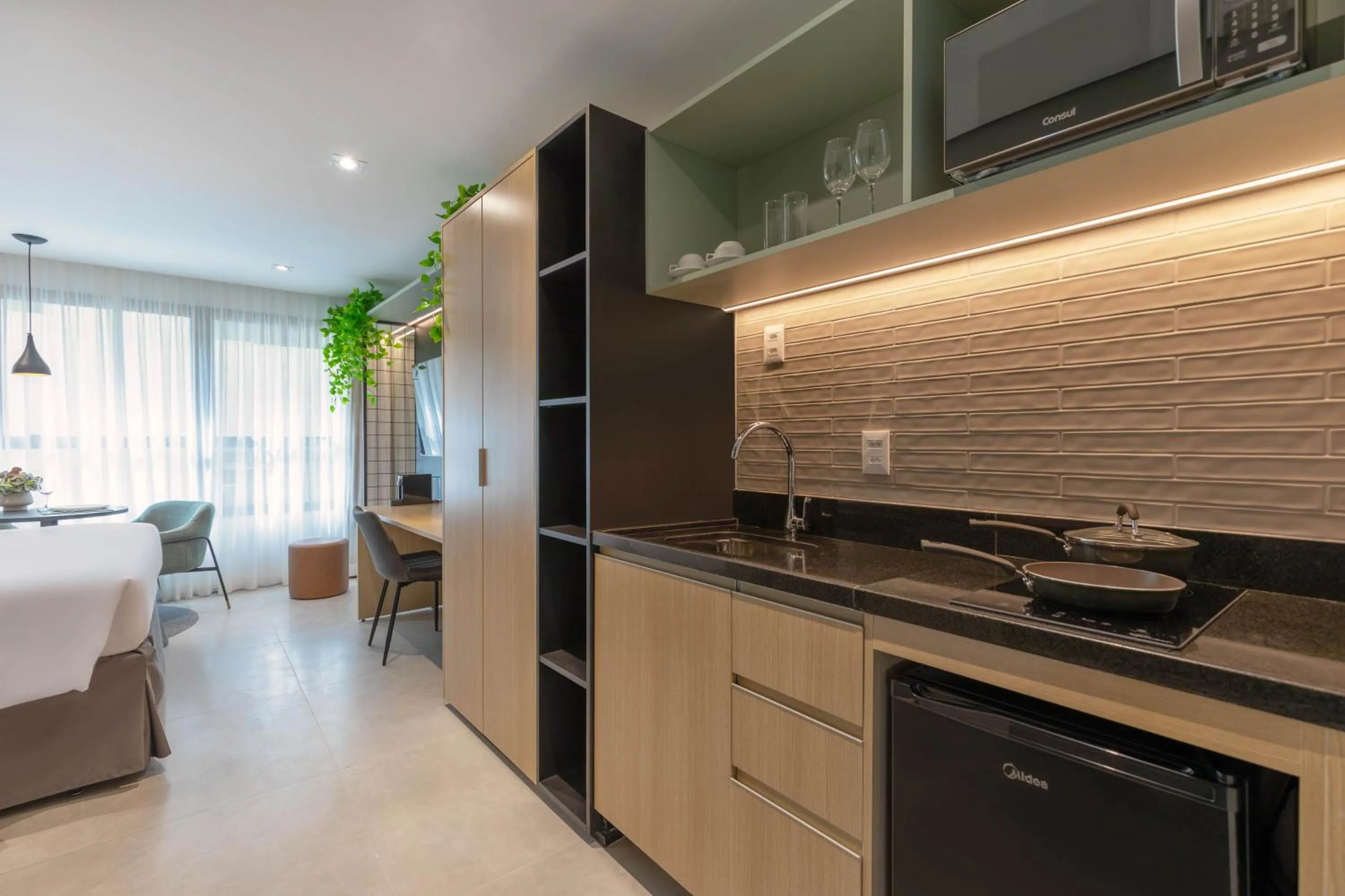 Kitchen or kitchenette in Cozzy Premium Paulista Hotel