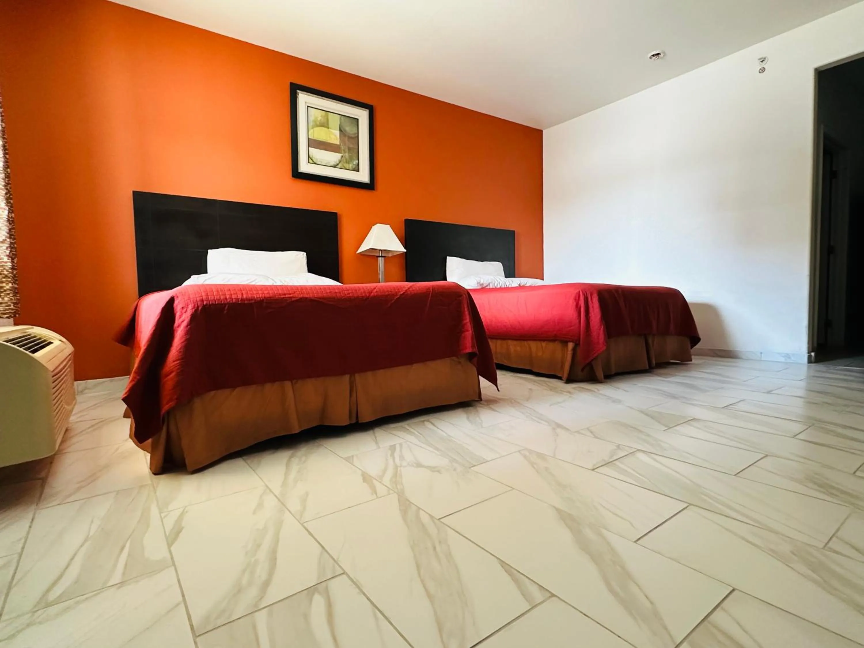 Bed in Lux Inn and Suites