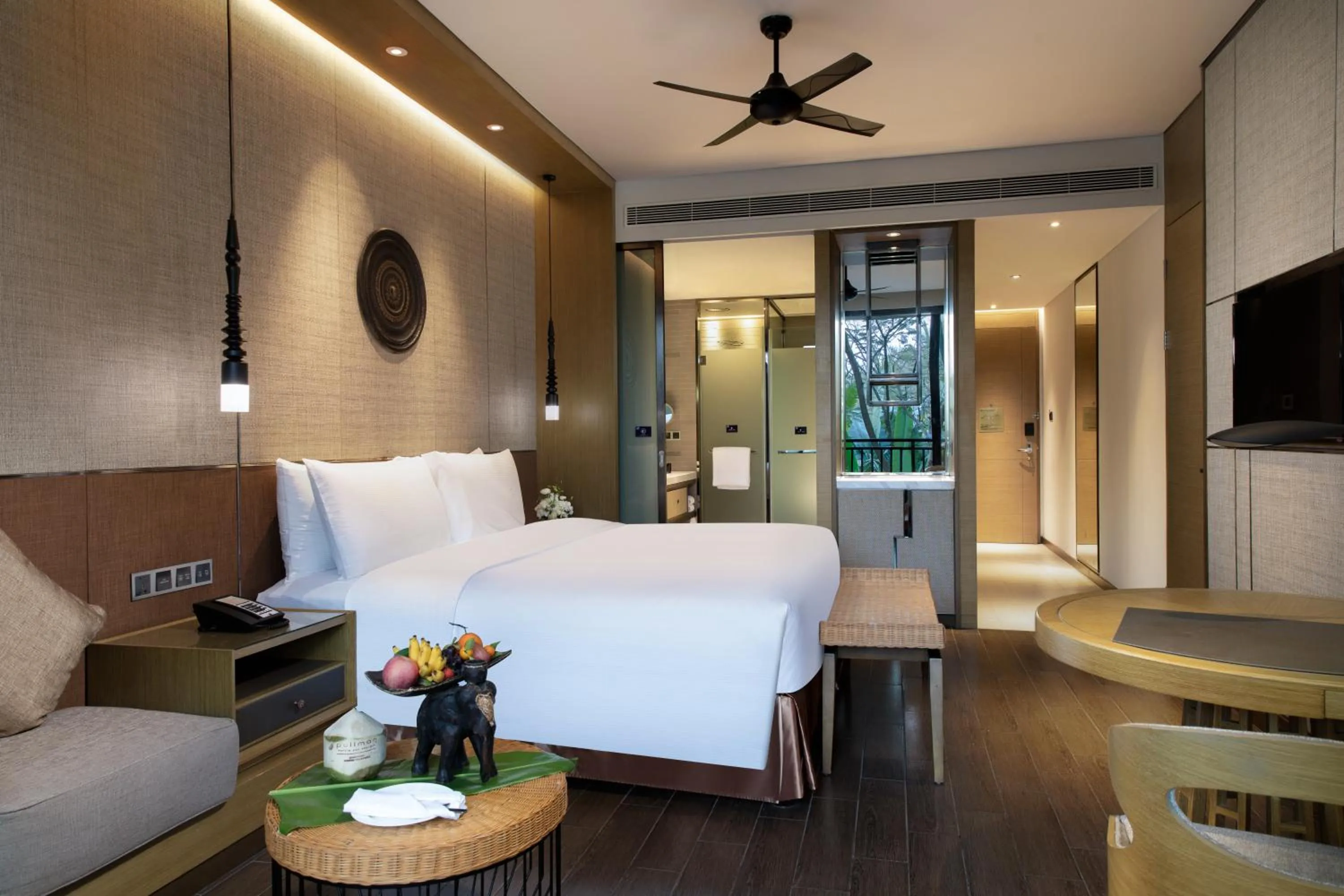 Photo of the whole room, Bed in Pullman Resort Xishuangbanna