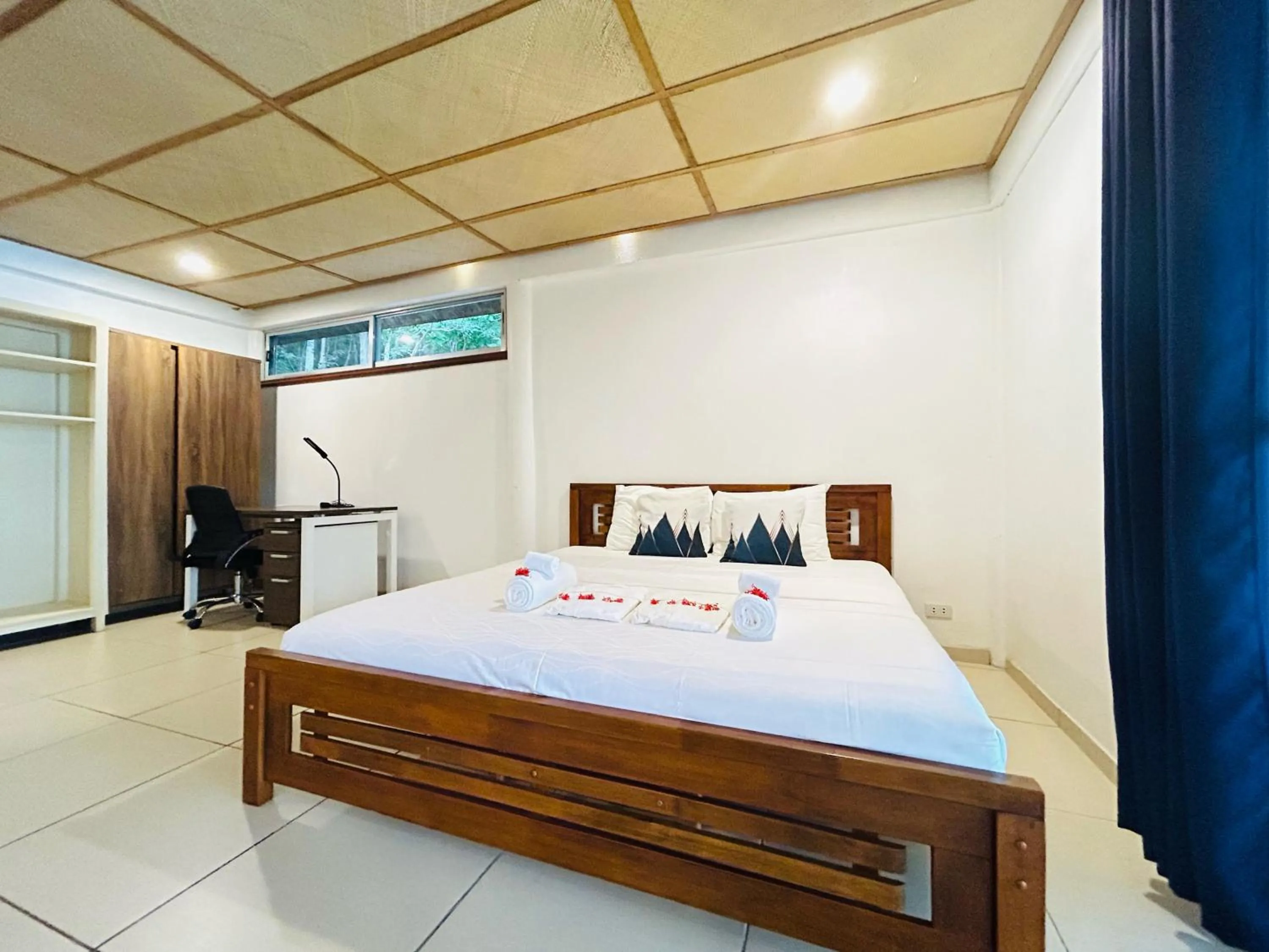 Bed in Chindonan Dive and Beach Resort