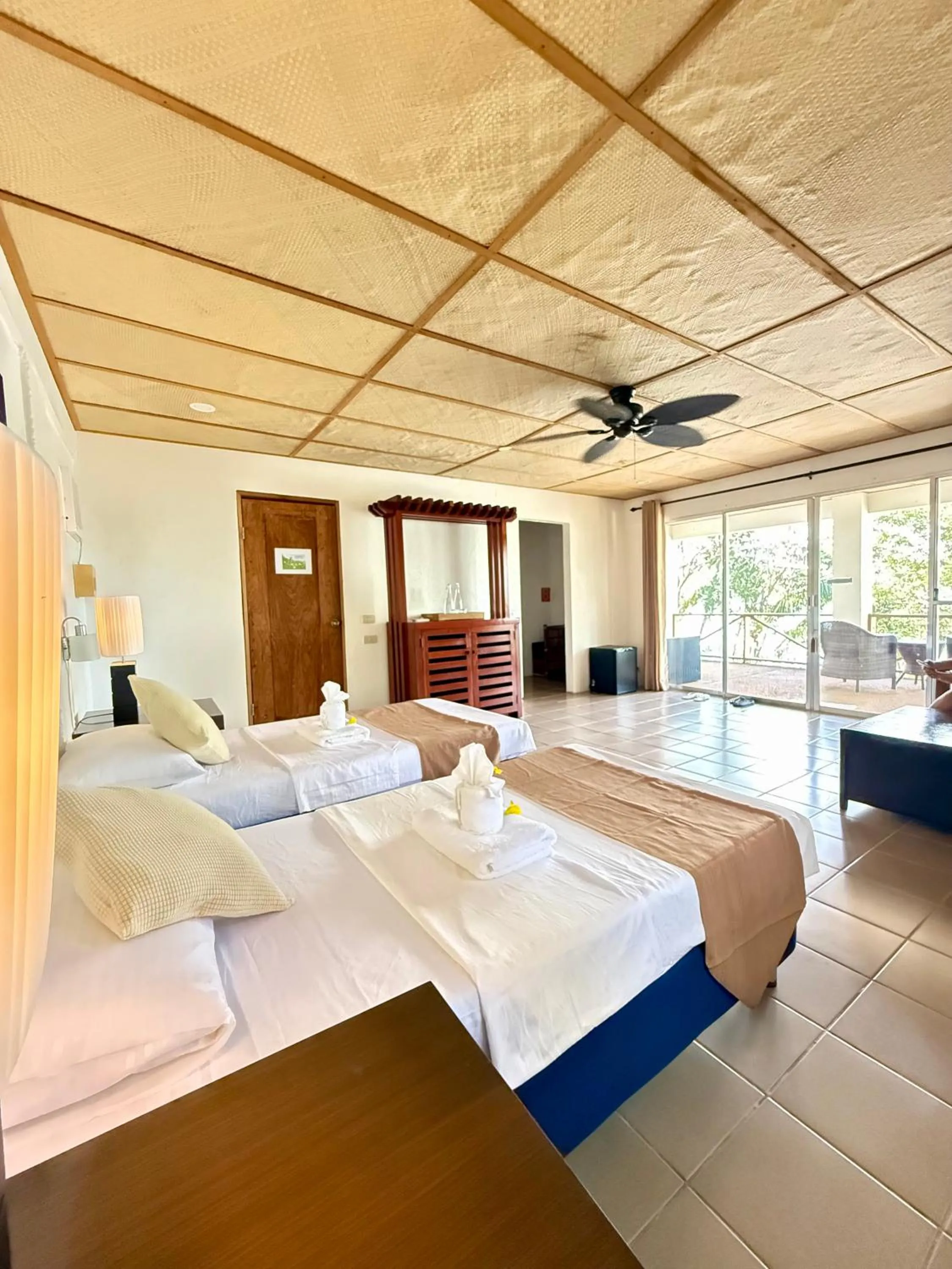 Bed in Chindonan Dive and Beach Resort