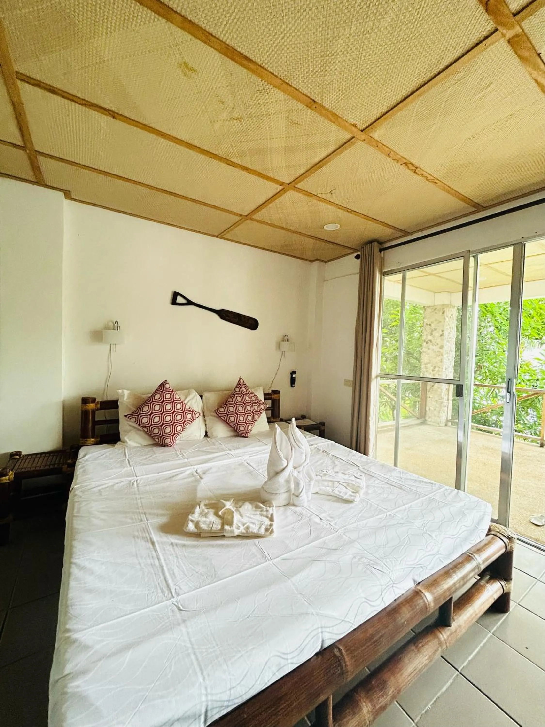 Bed in Chindonan Dive and Beach Resort