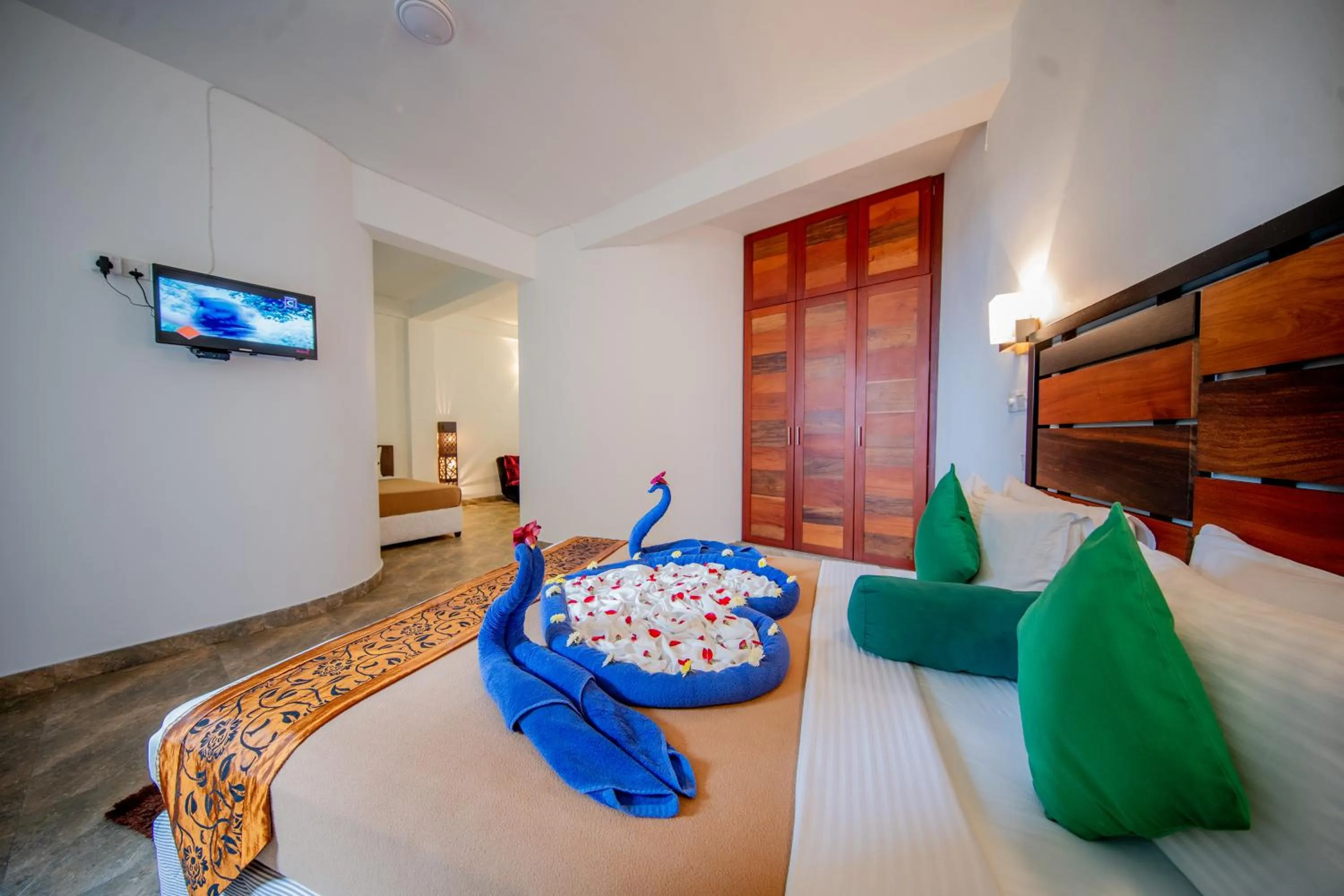 Bed in Olympus Plaza Hotel