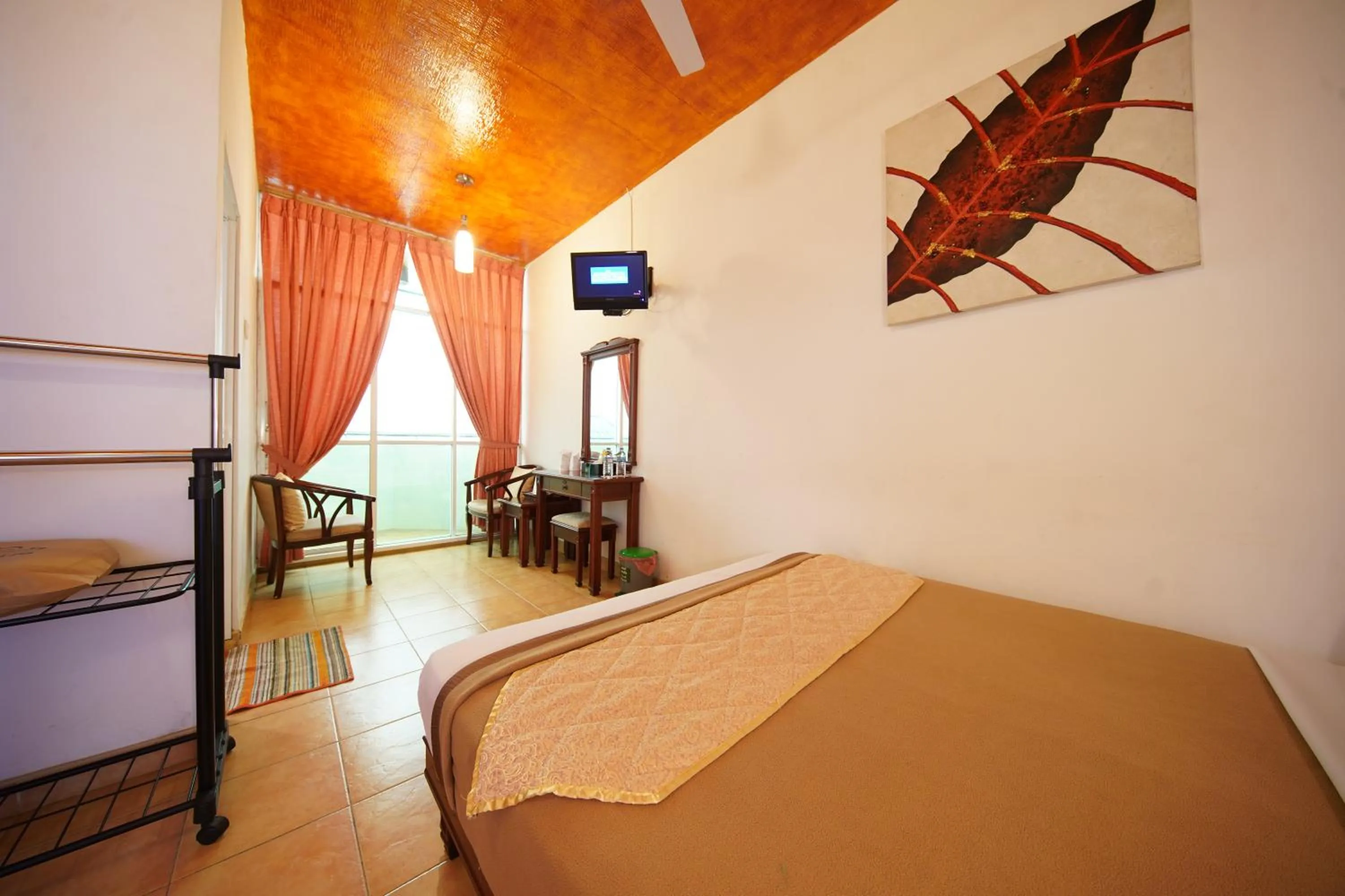 Bed in Olympus Plaza Hotel