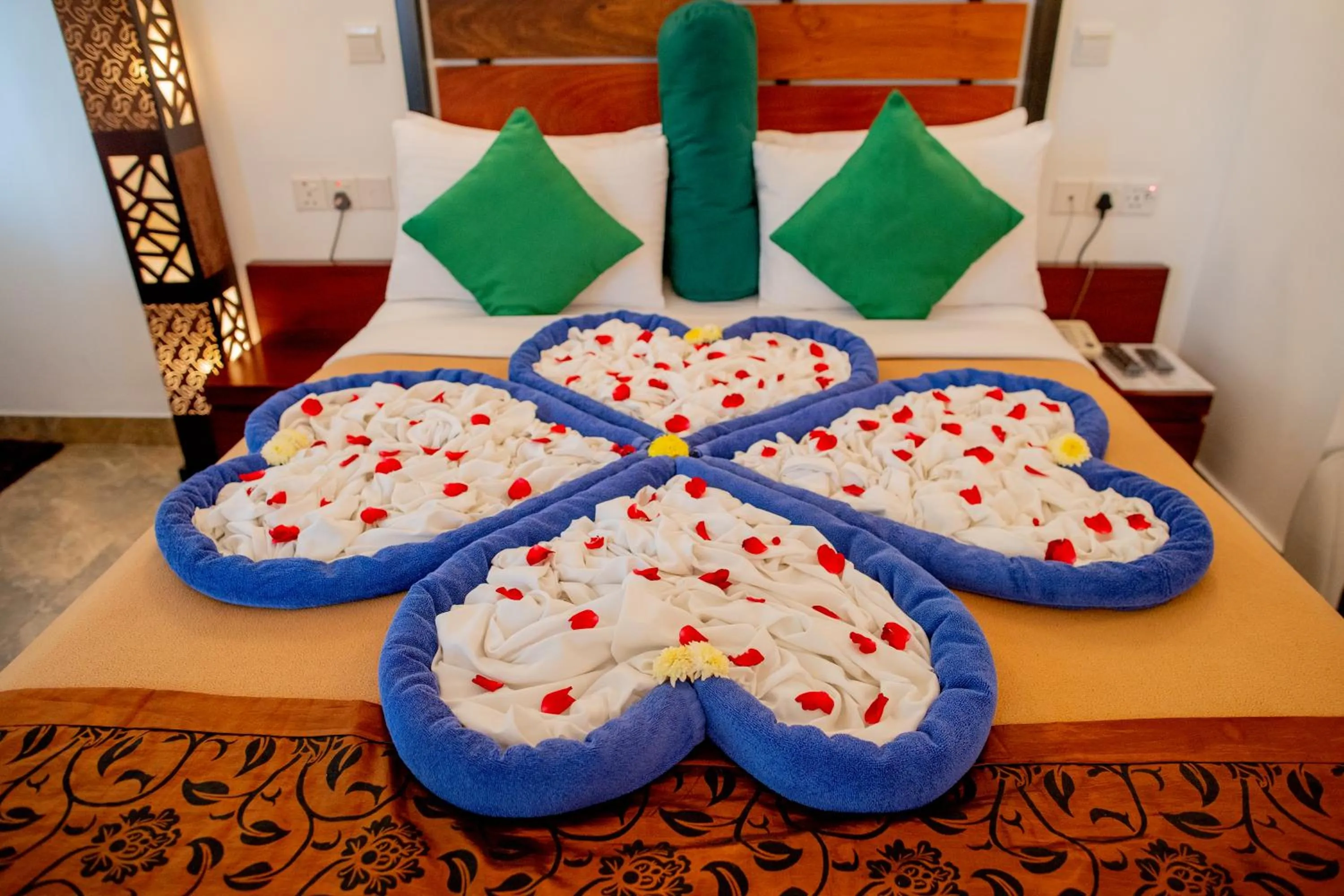 Bed in Olympus Plaza Hotel