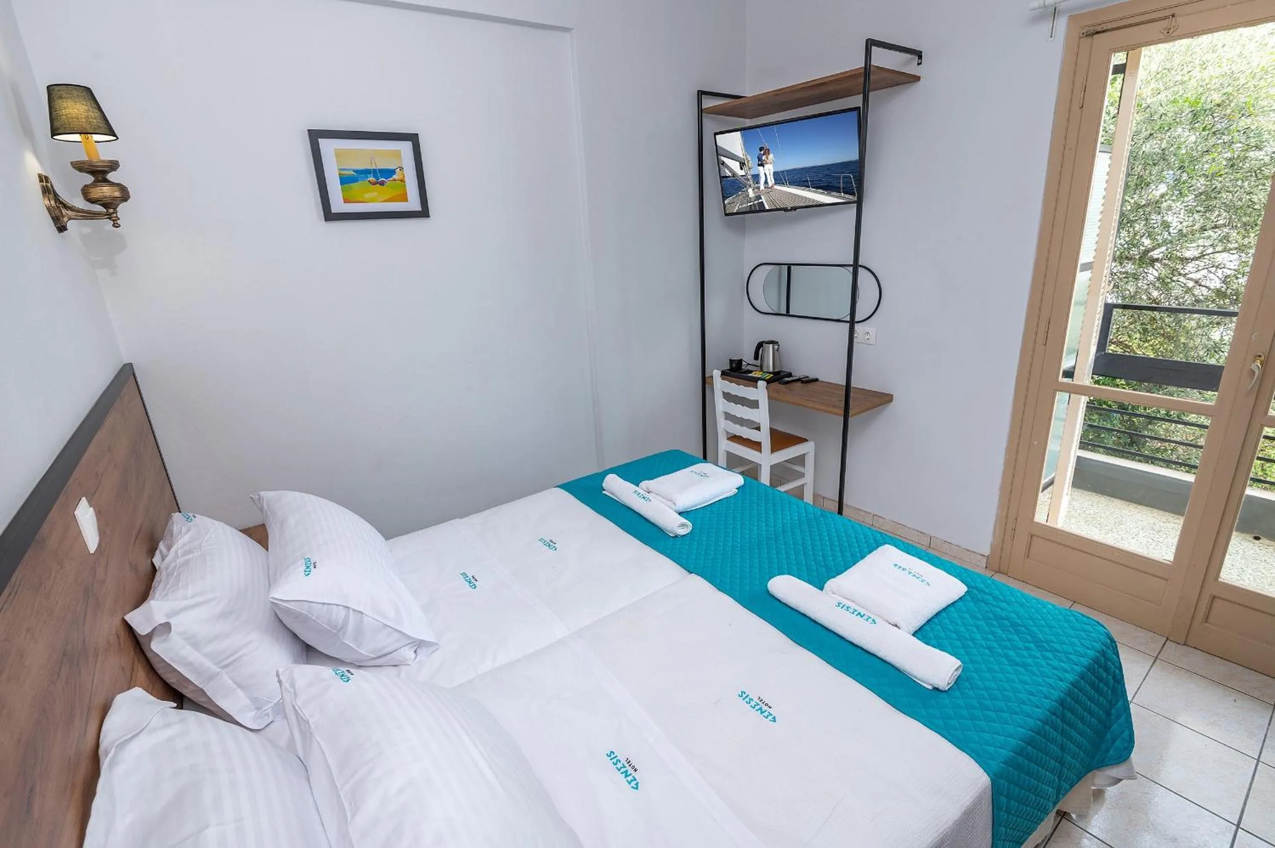 Bed in Genesis Hotel