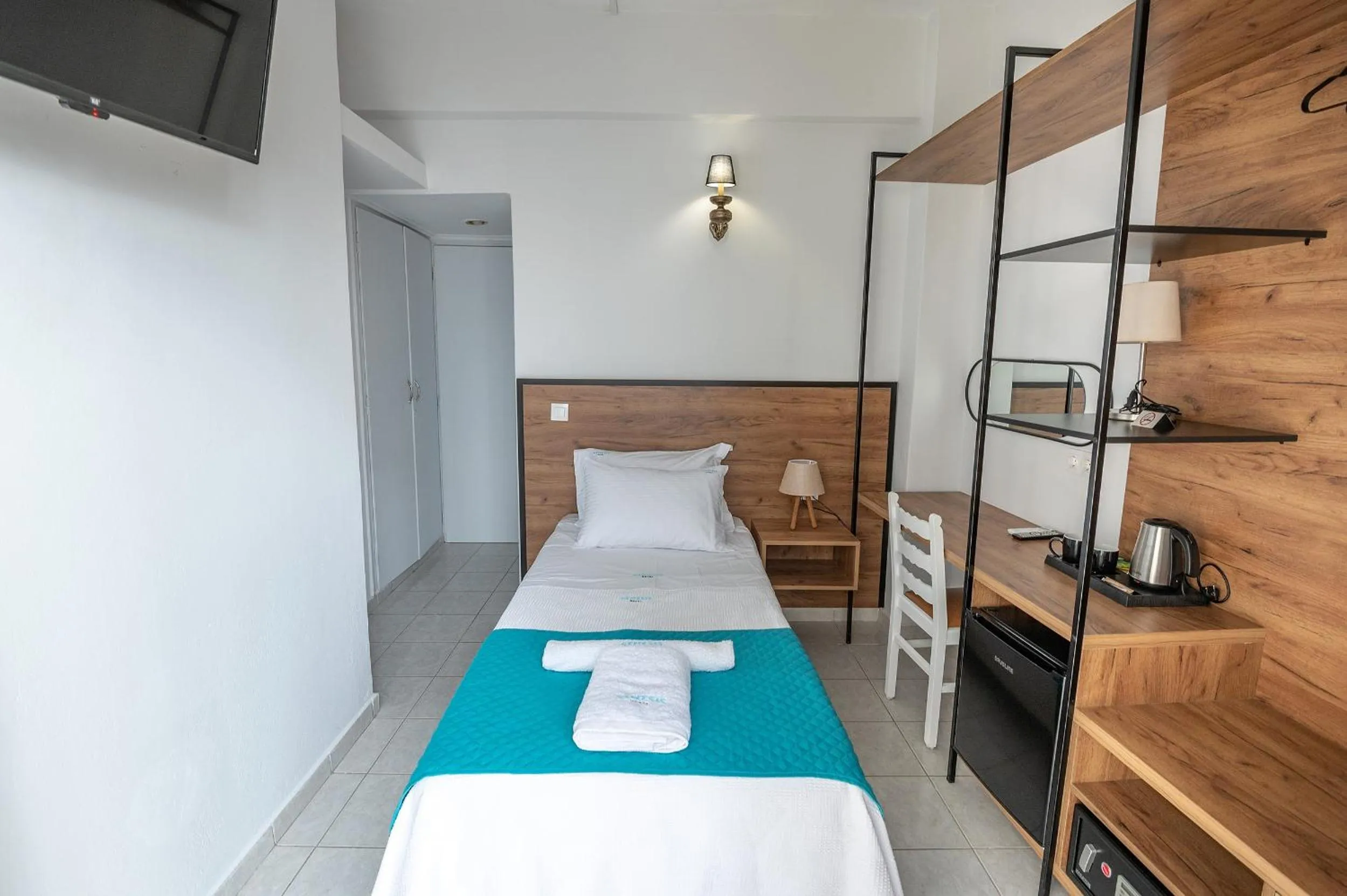 Bed in Genesis Hotel