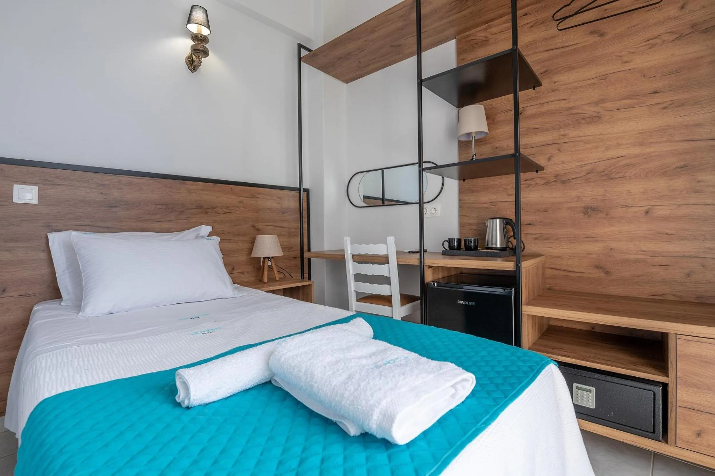 Bed in Genesis Hotel