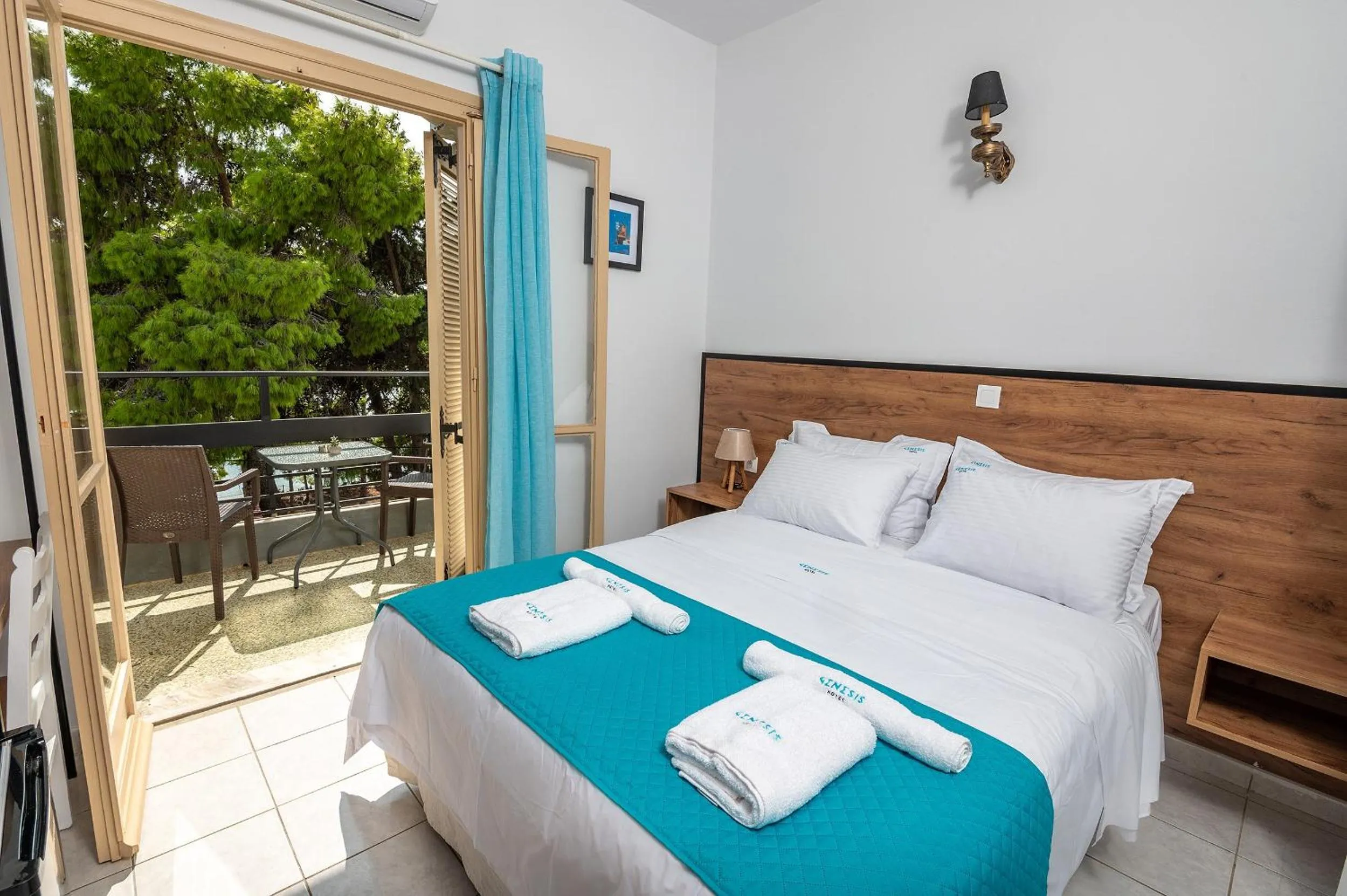 Bed in Genesis Hotel