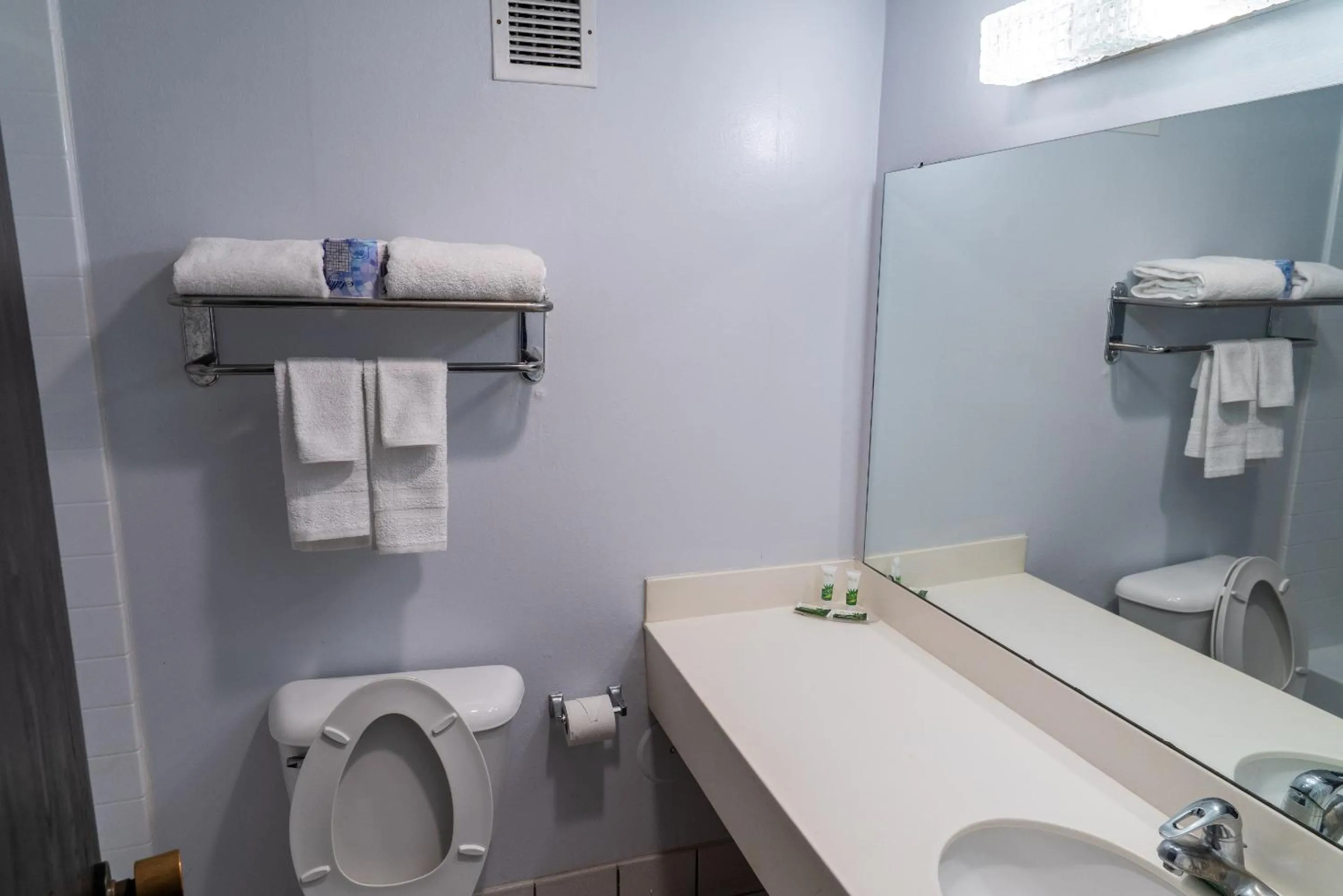 Toilet in Coratel Inn and Suites By Jasper Lacrosse