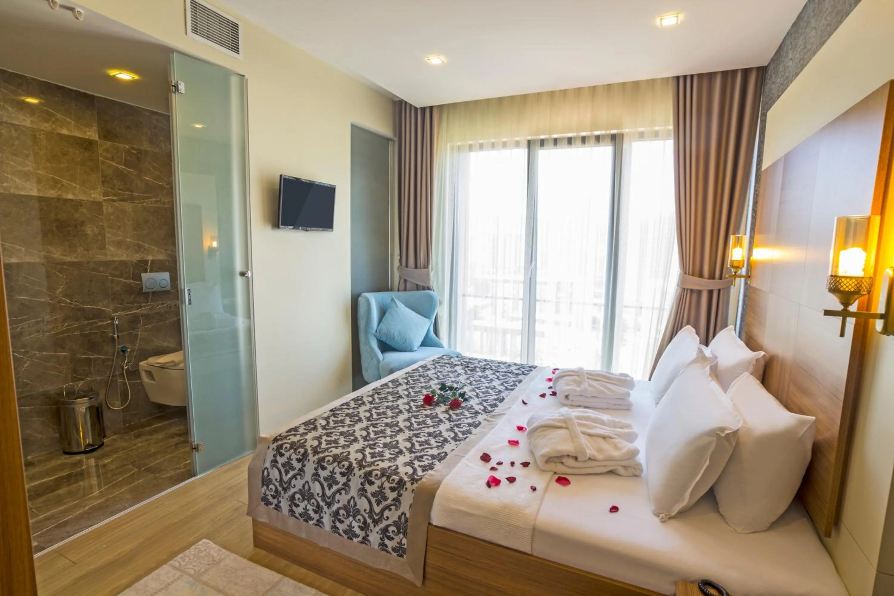 Bed in Alesha Suite Otel