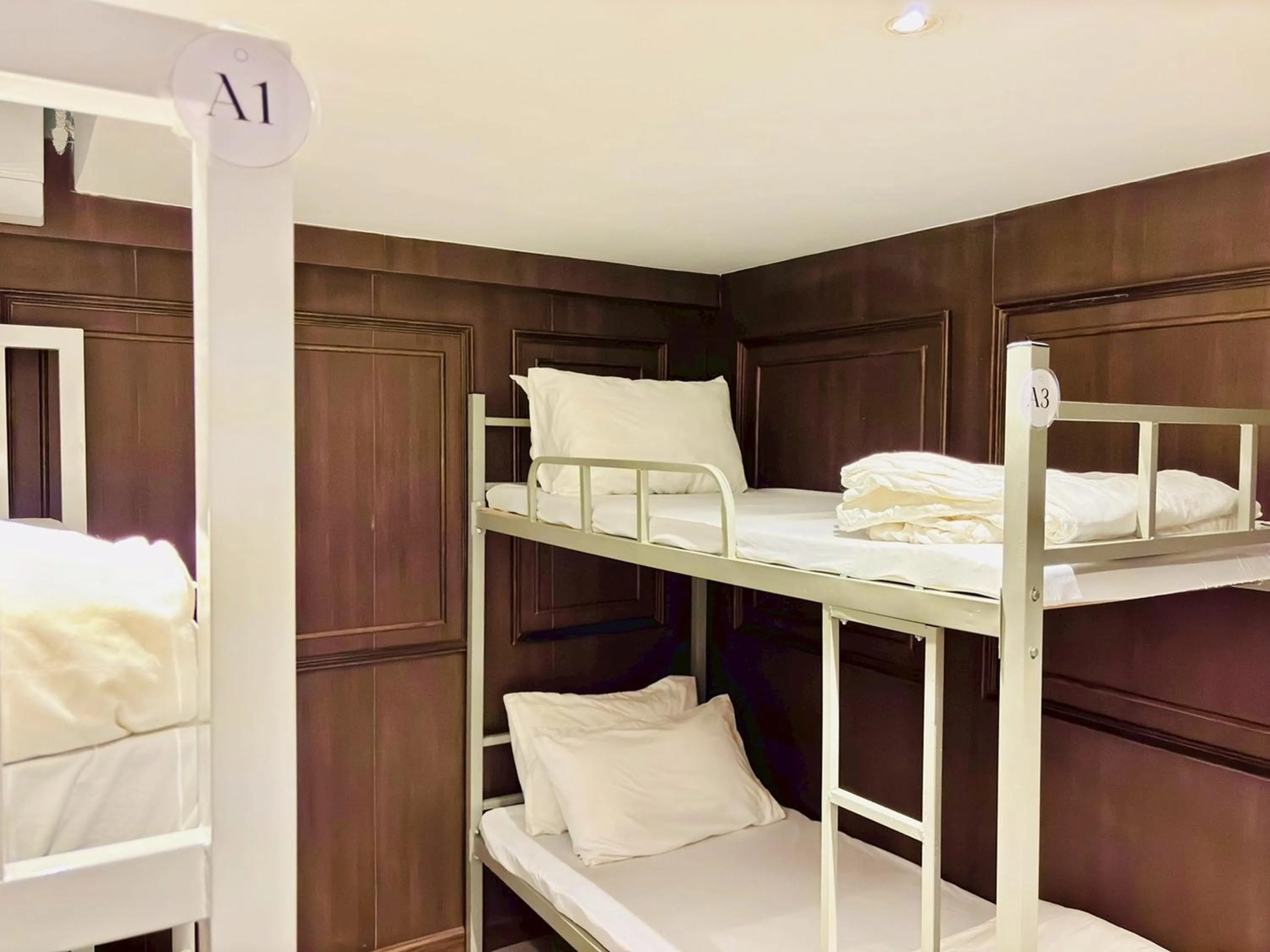 Bed in Sukhum Rajamangala-Phatthanakan Rooms