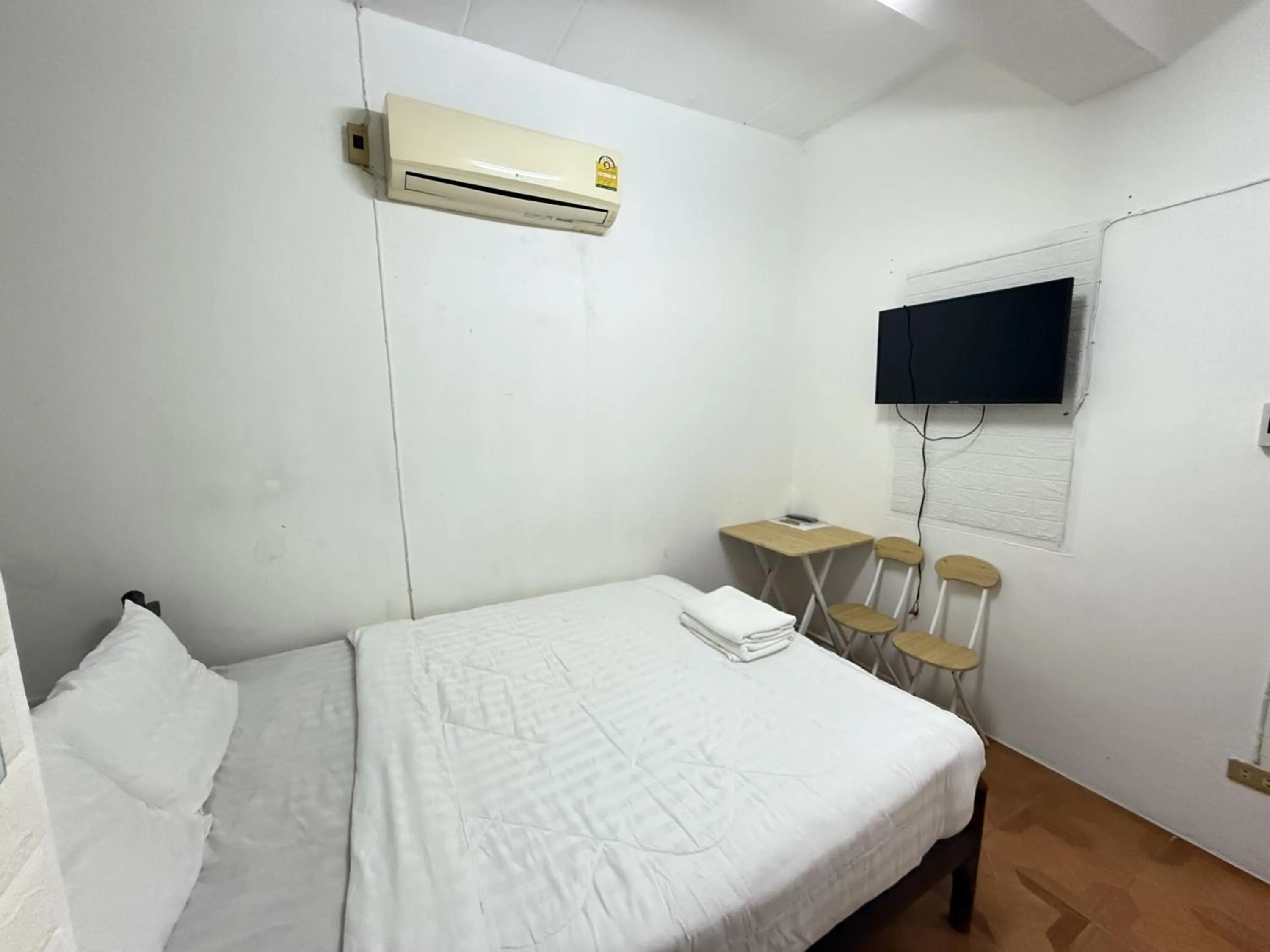 Bed in Happyland Guesthouse