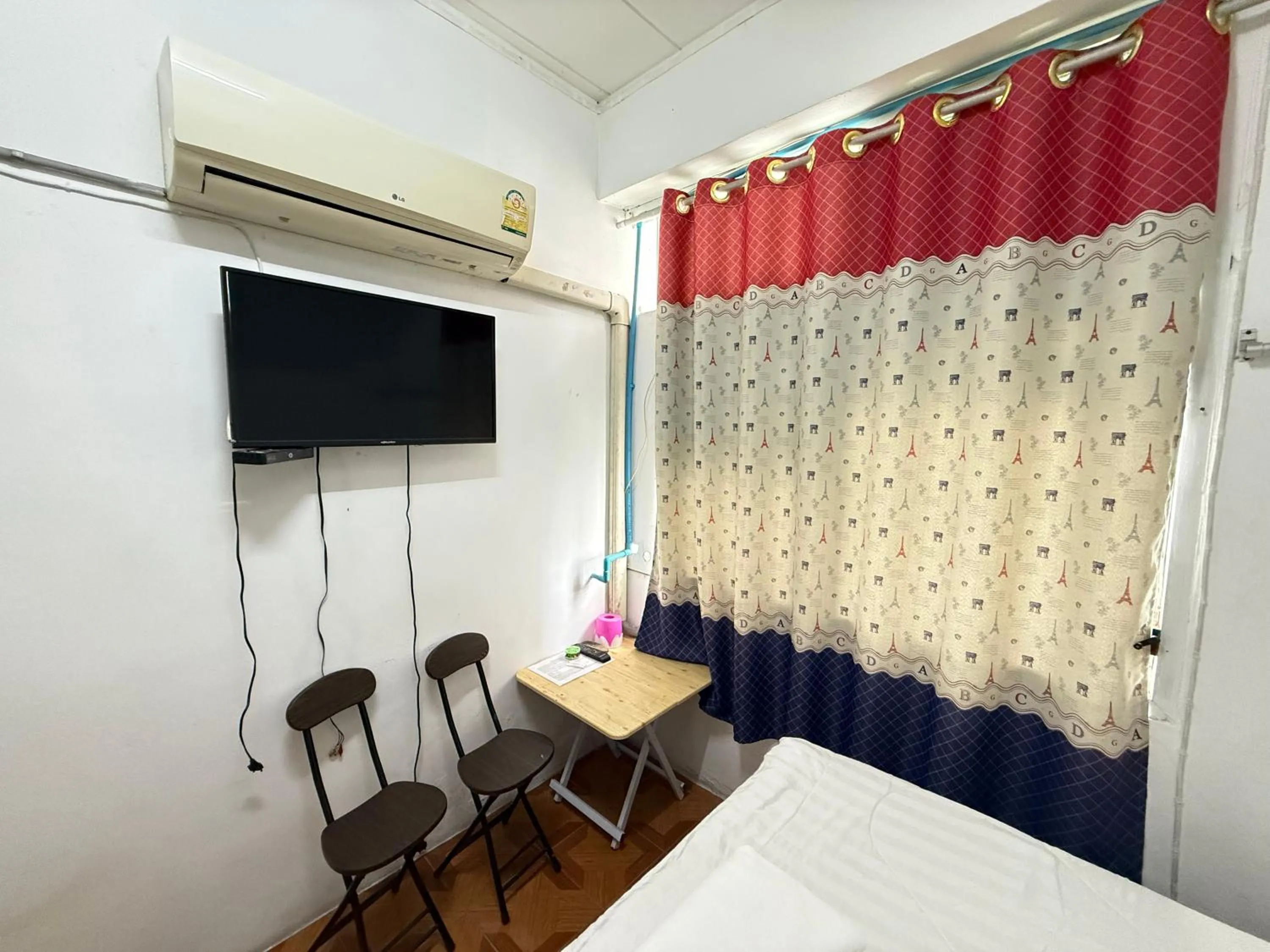 Bed in Happyland Guesthouse