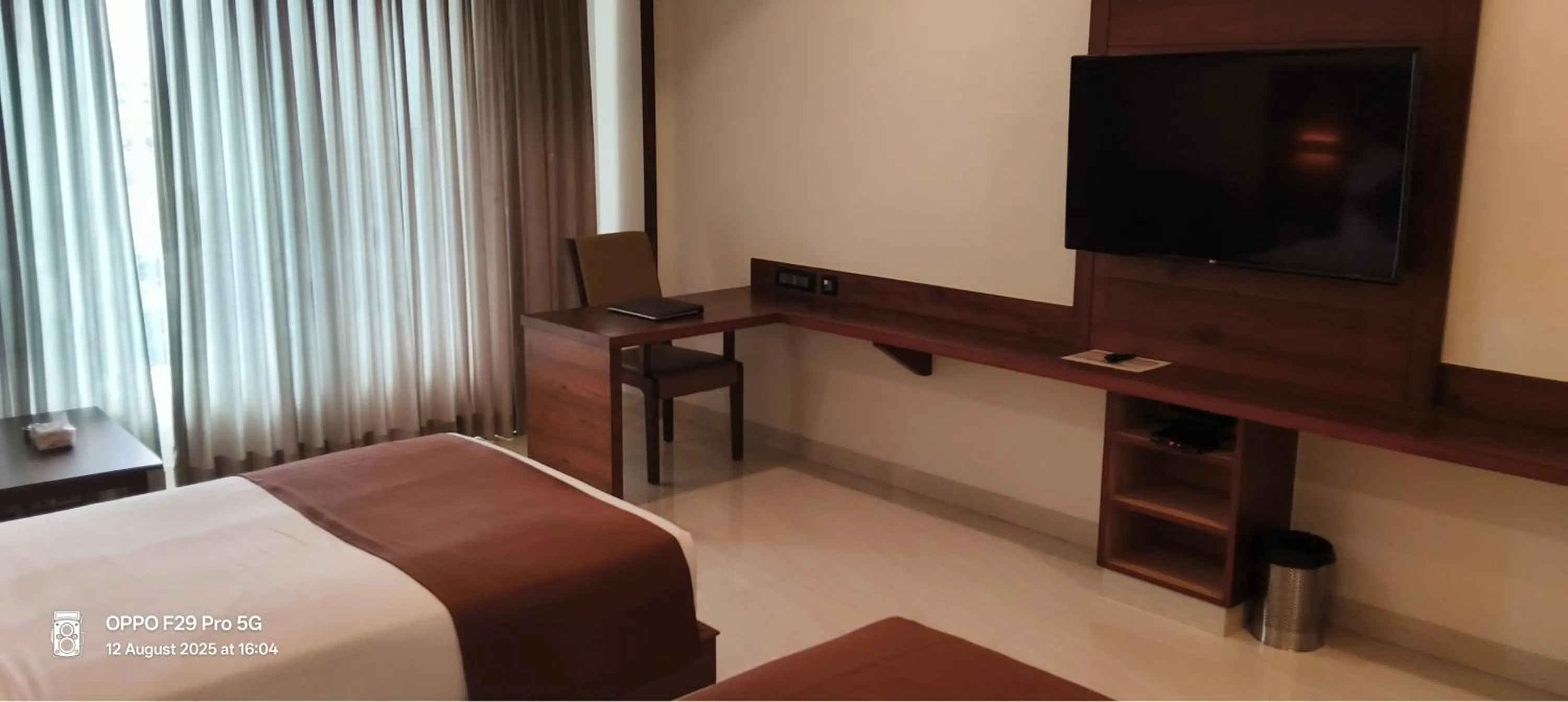 Communal lounge/ TV room, Bed in Royal Ritis Hubballi