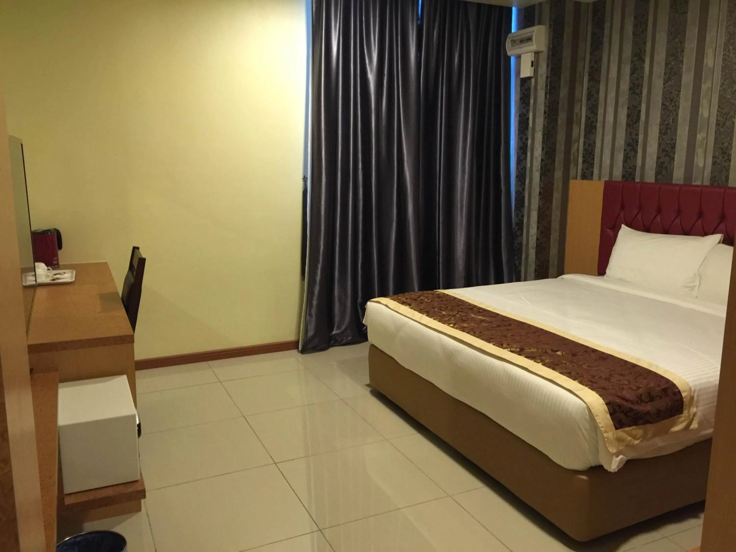 Bed in Prince 33 Hotel