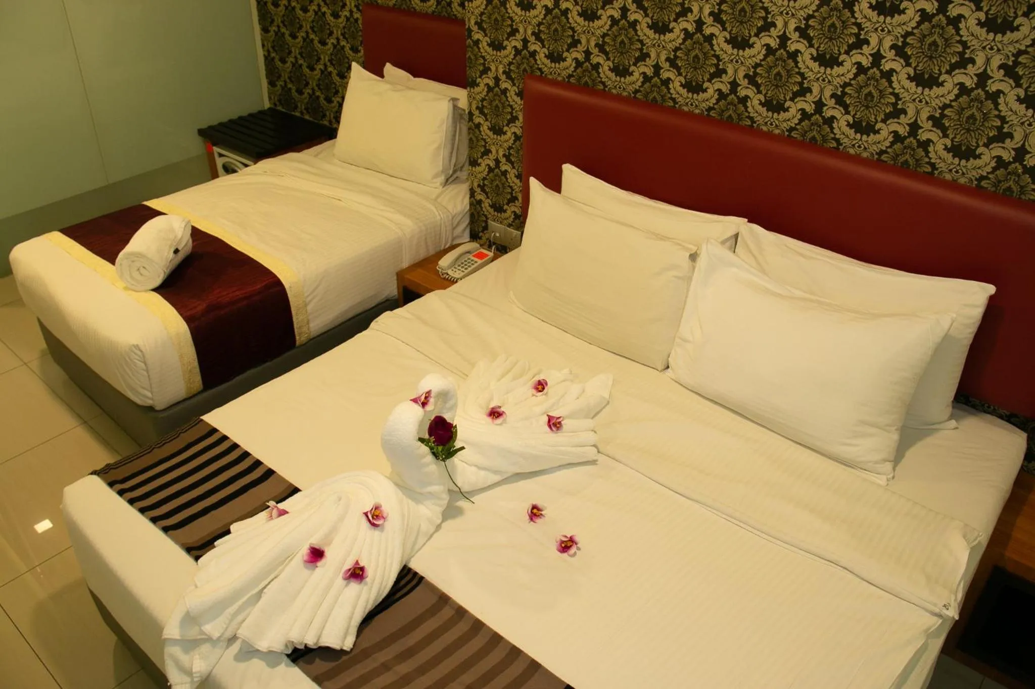 Bed in Prince 33 Hotel