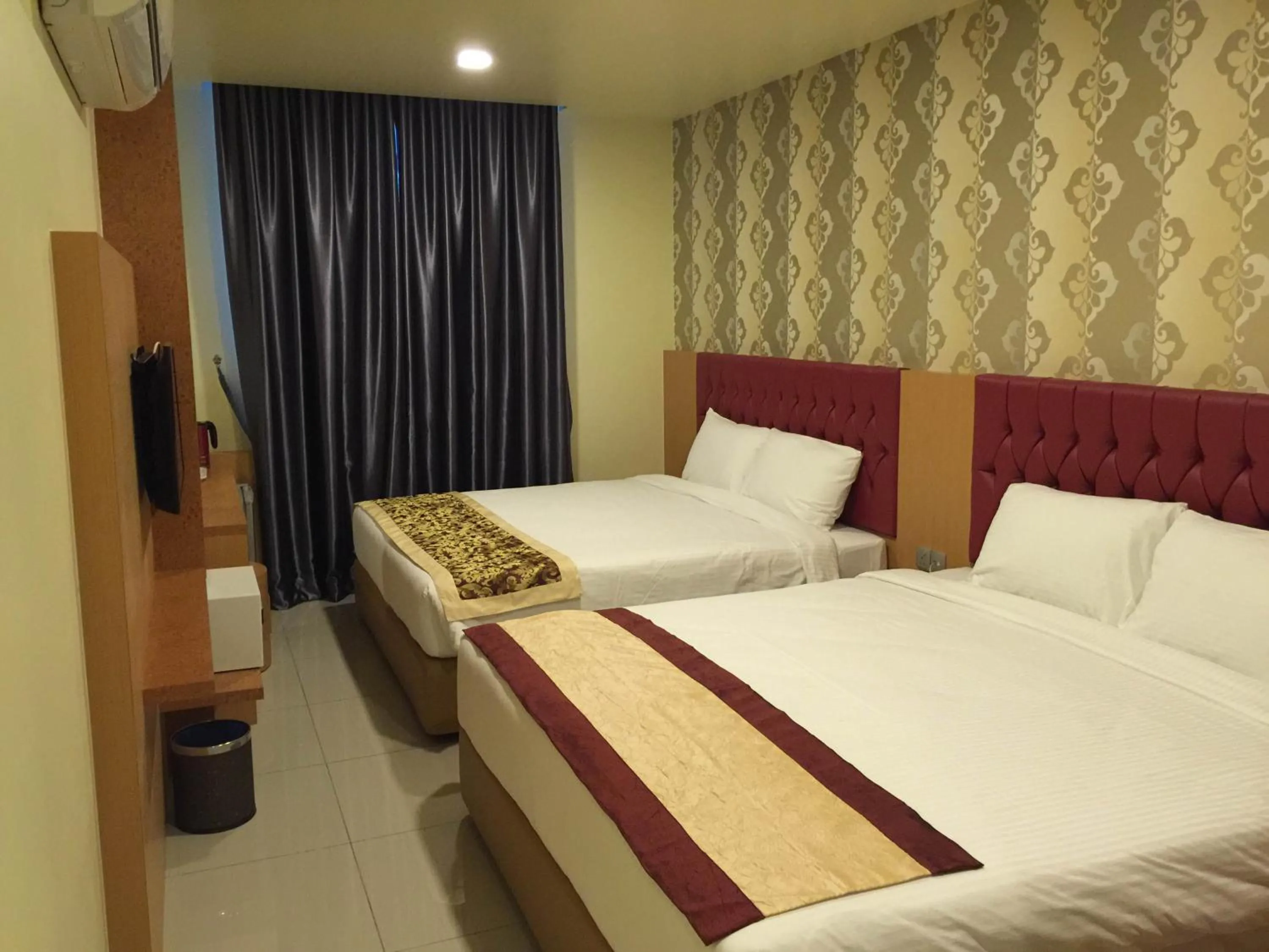 Bed in Prince 33 Hotel