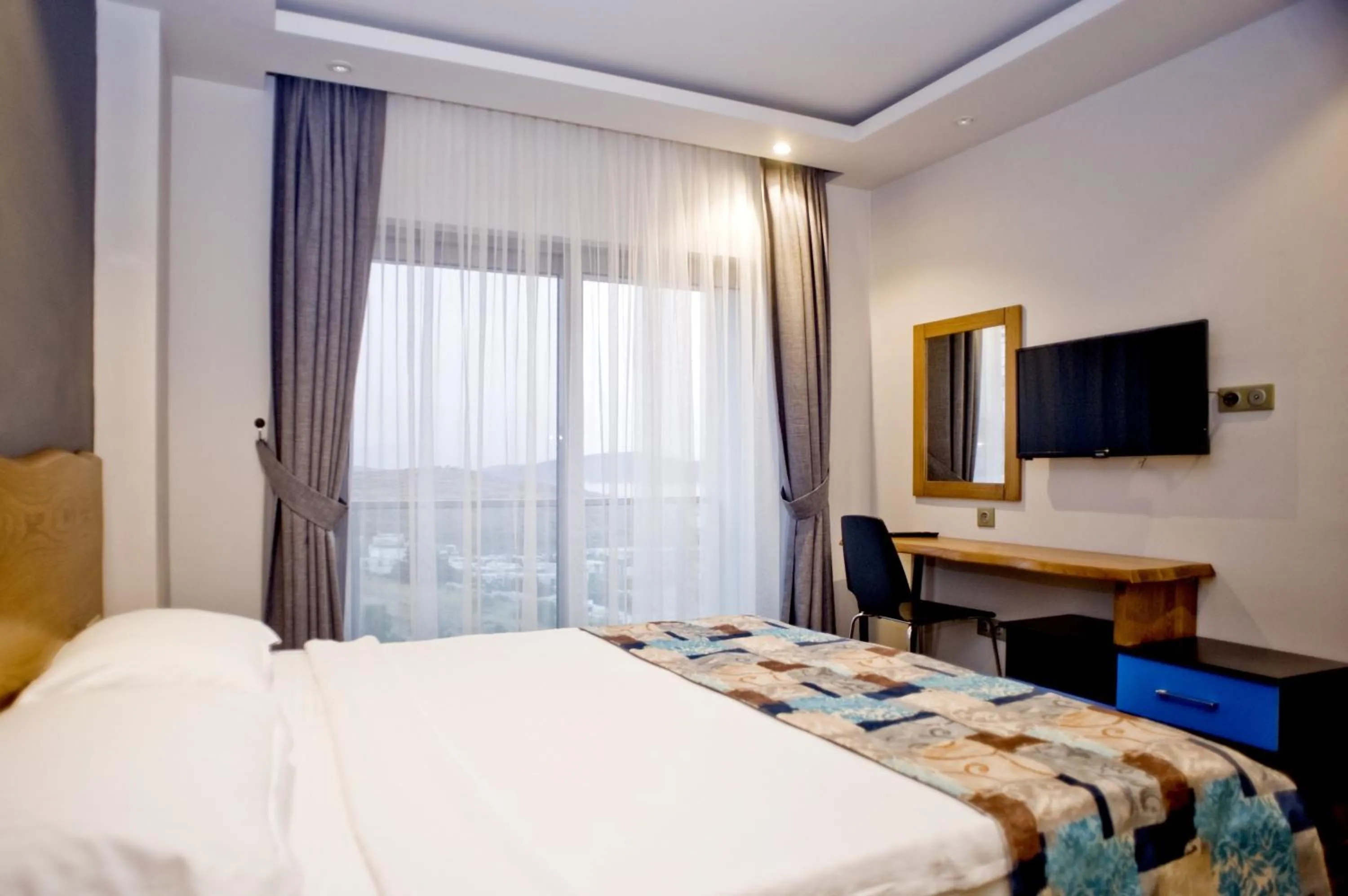 Bed in Degirmenburnu Residence