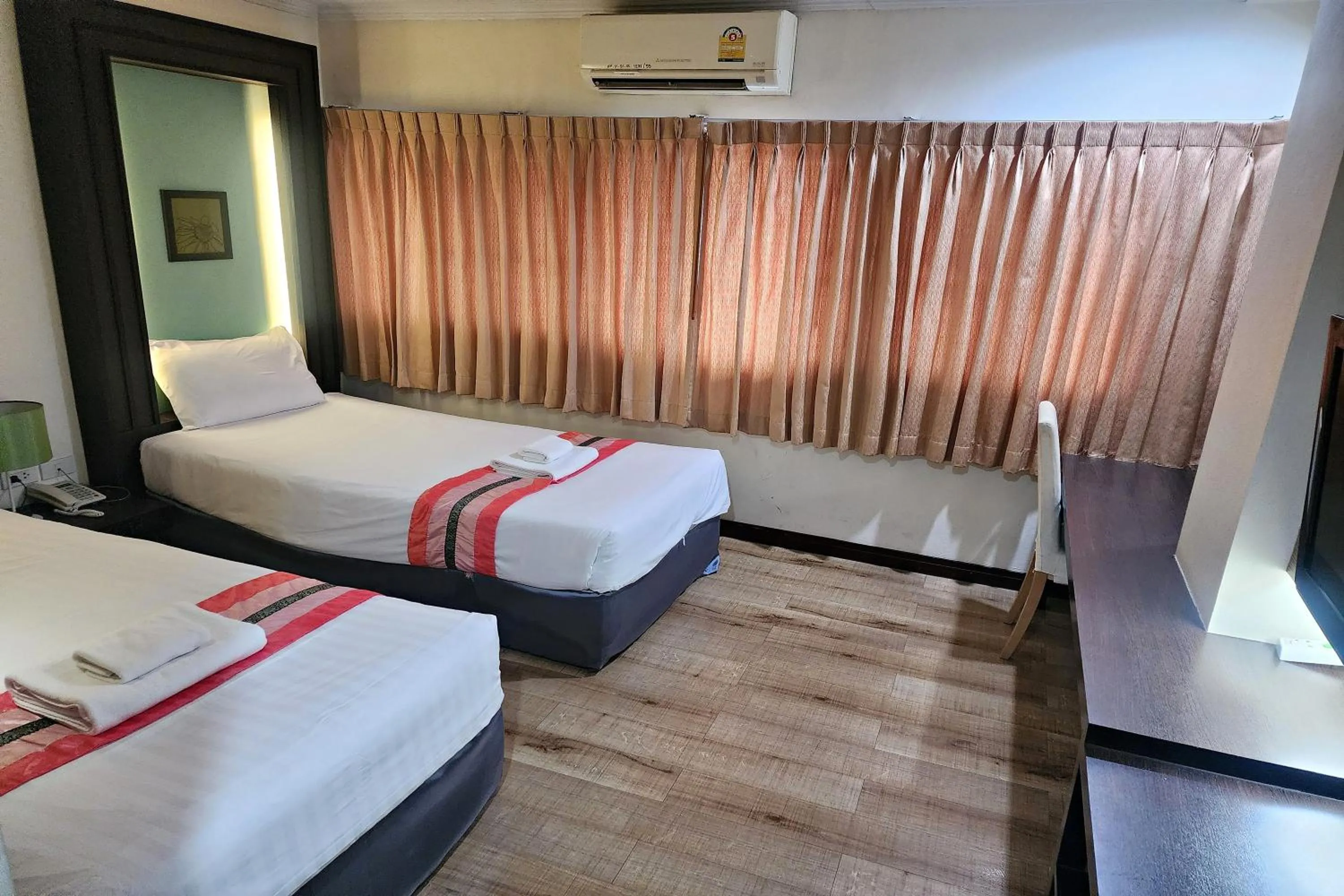 Bed in Suan Sunandha Palace Hotel