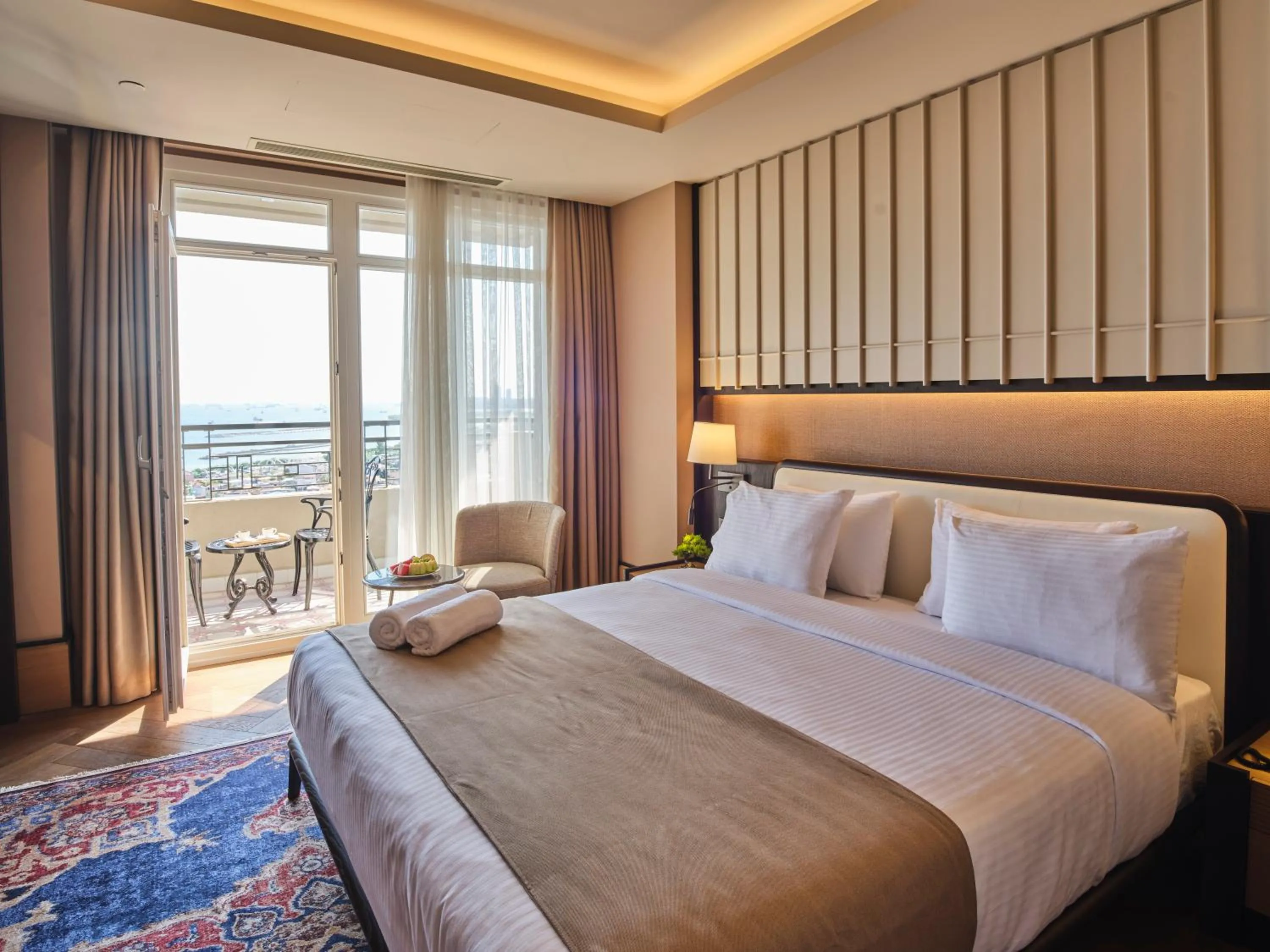 Bed in Four-G Hotel Premium