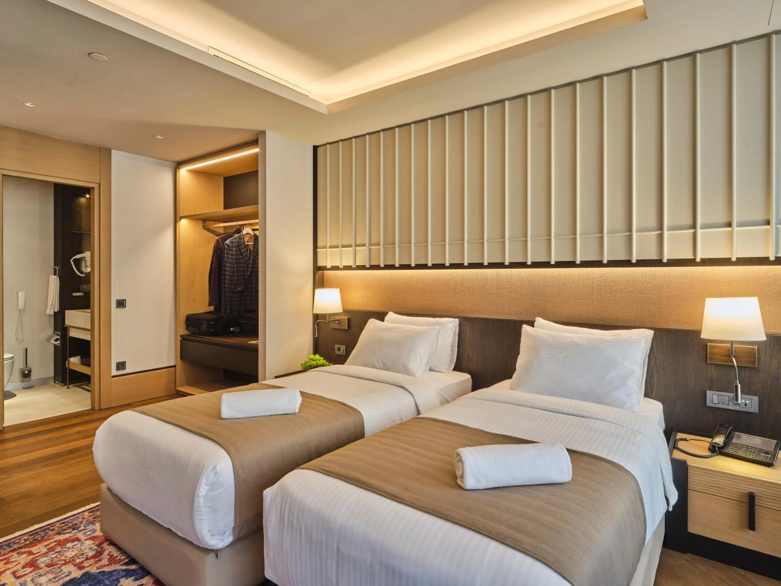 Bed in Four-G Hotel Premium