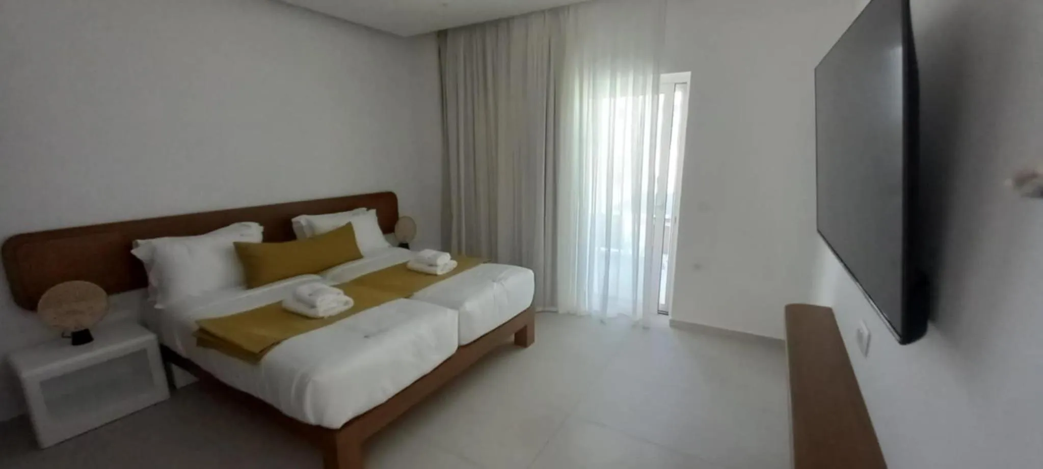 Bed in Tarra Seaside Hotel