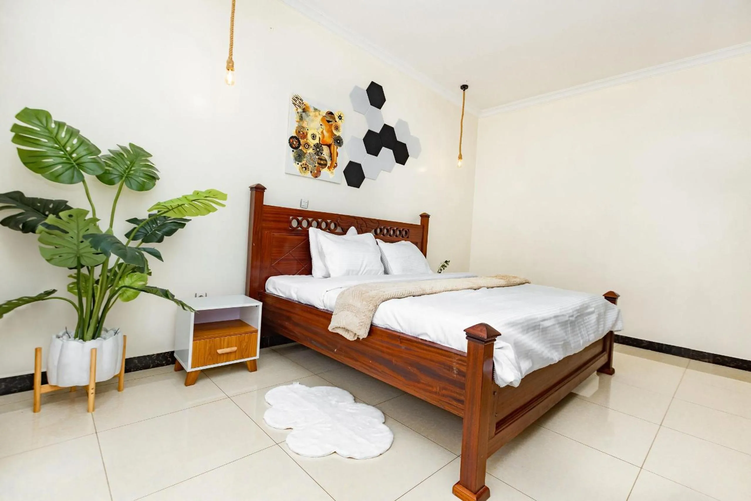 Photo of the whole room, Bed in kigali Pillar House inn