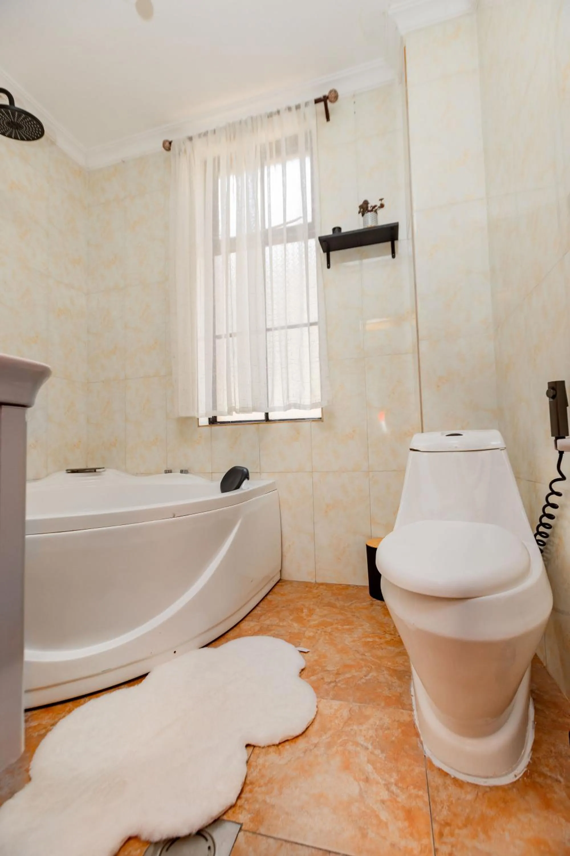 Toilet in kigali Pillar House inn